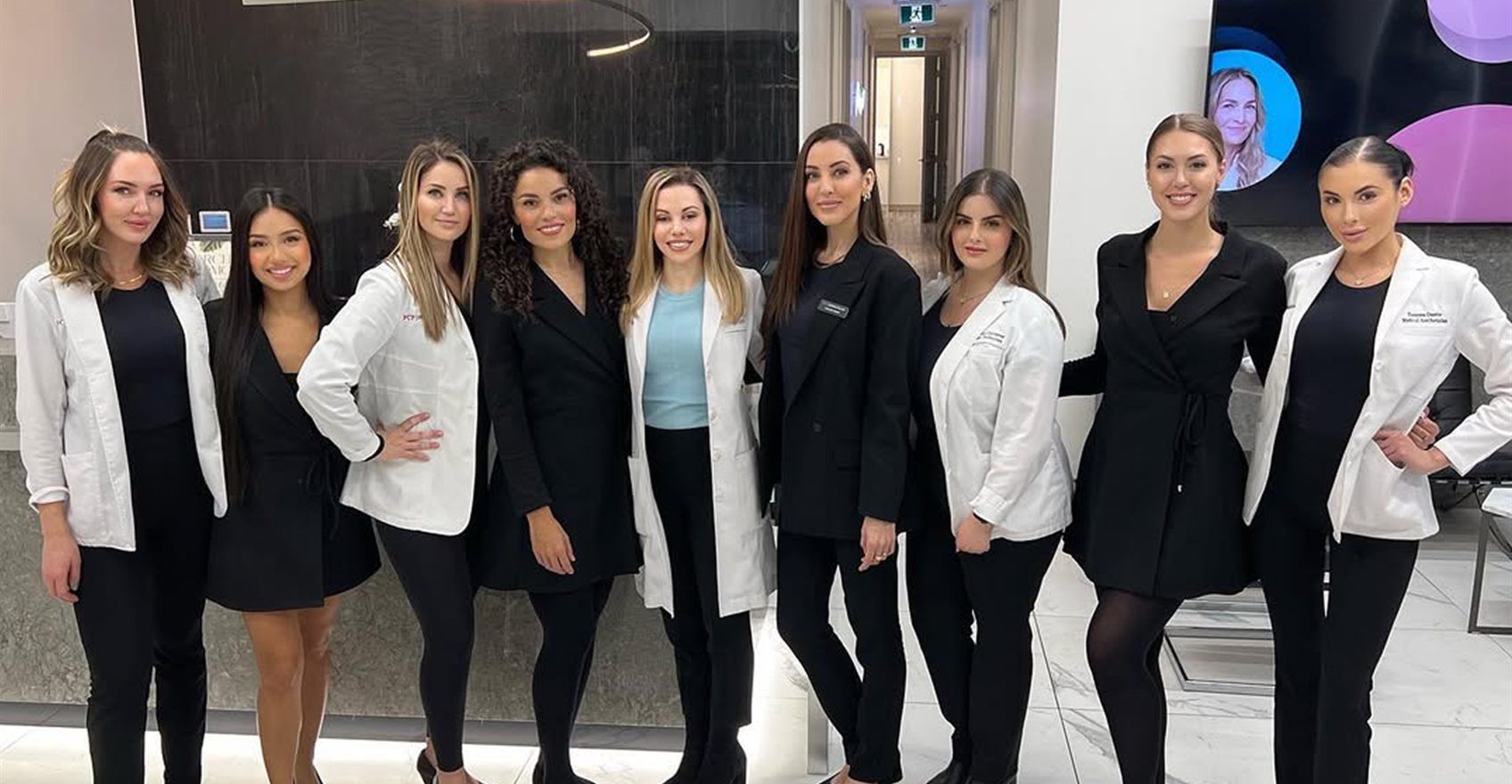The FCP Dermatology team photographed together in the clinic reception