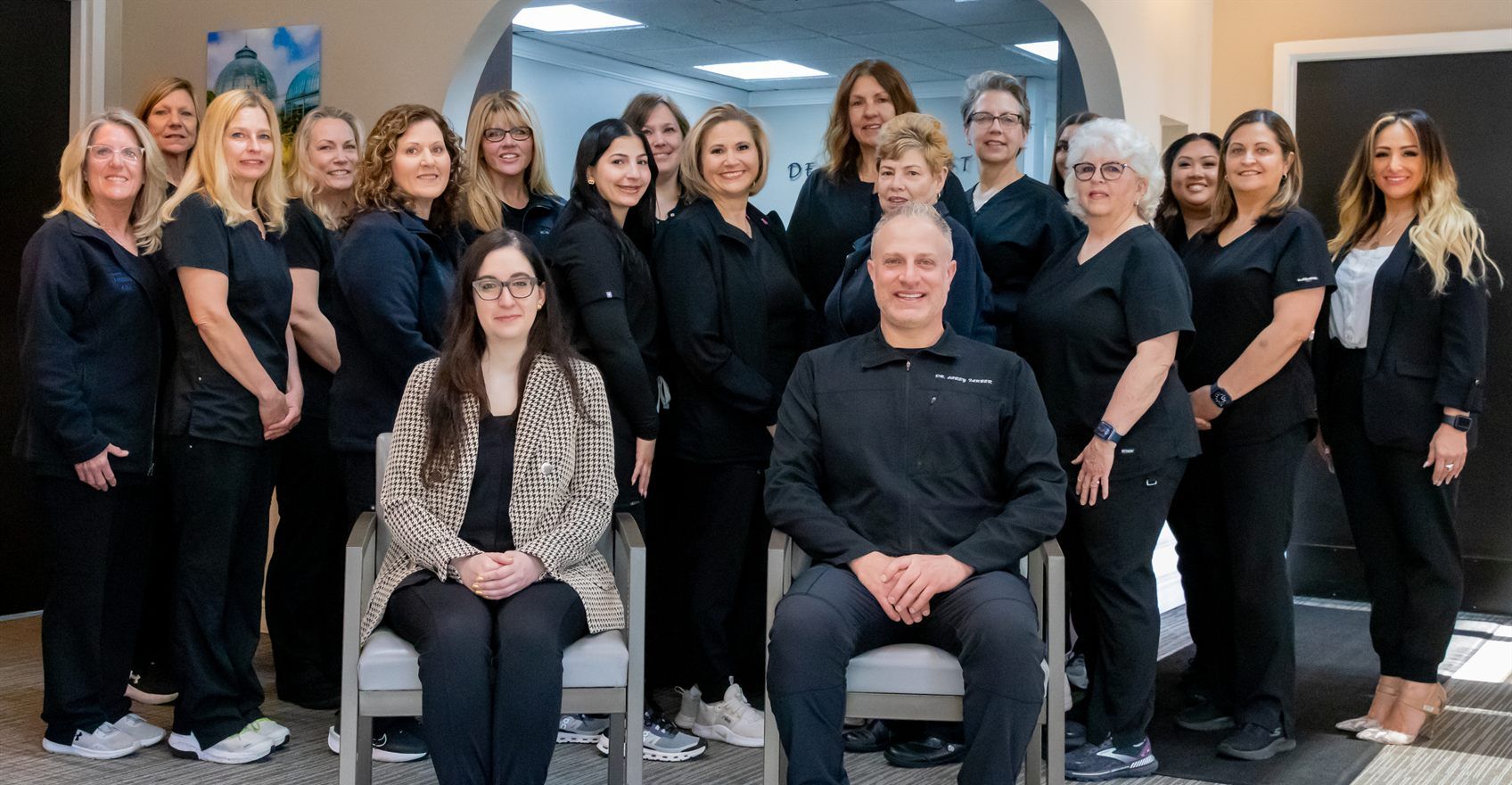 The Dearborn West Dental team photographed together in the clinic