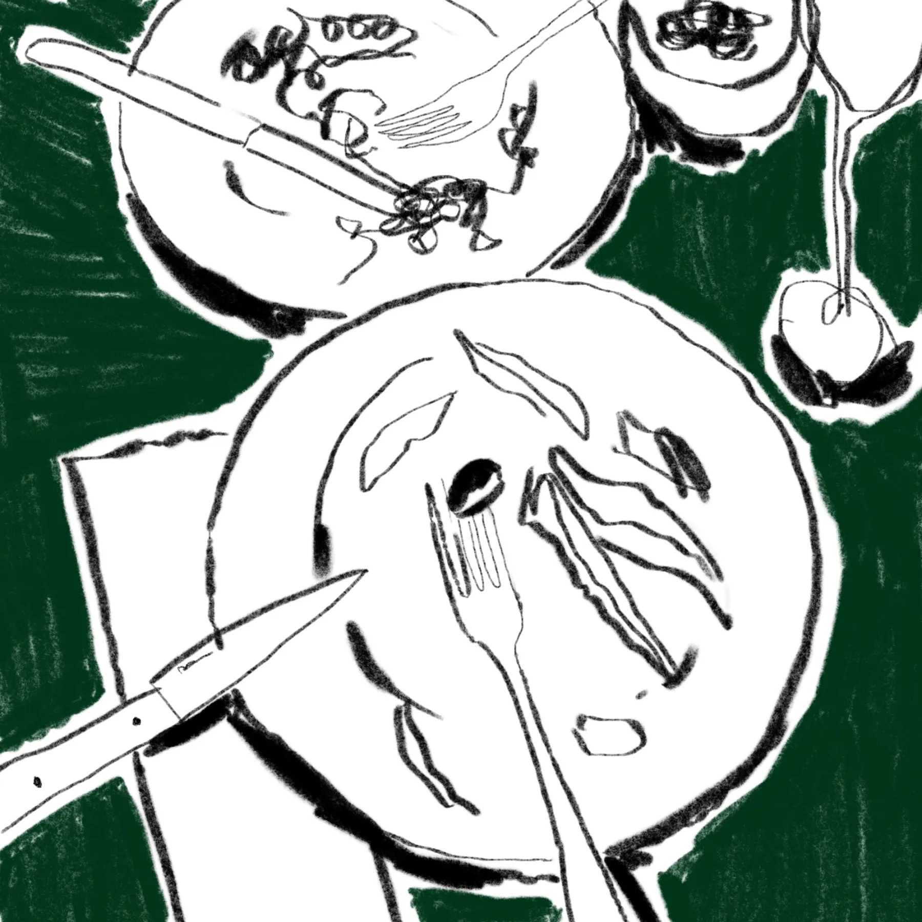 two plates with olives on them with a wine glass next to the plate on a green table