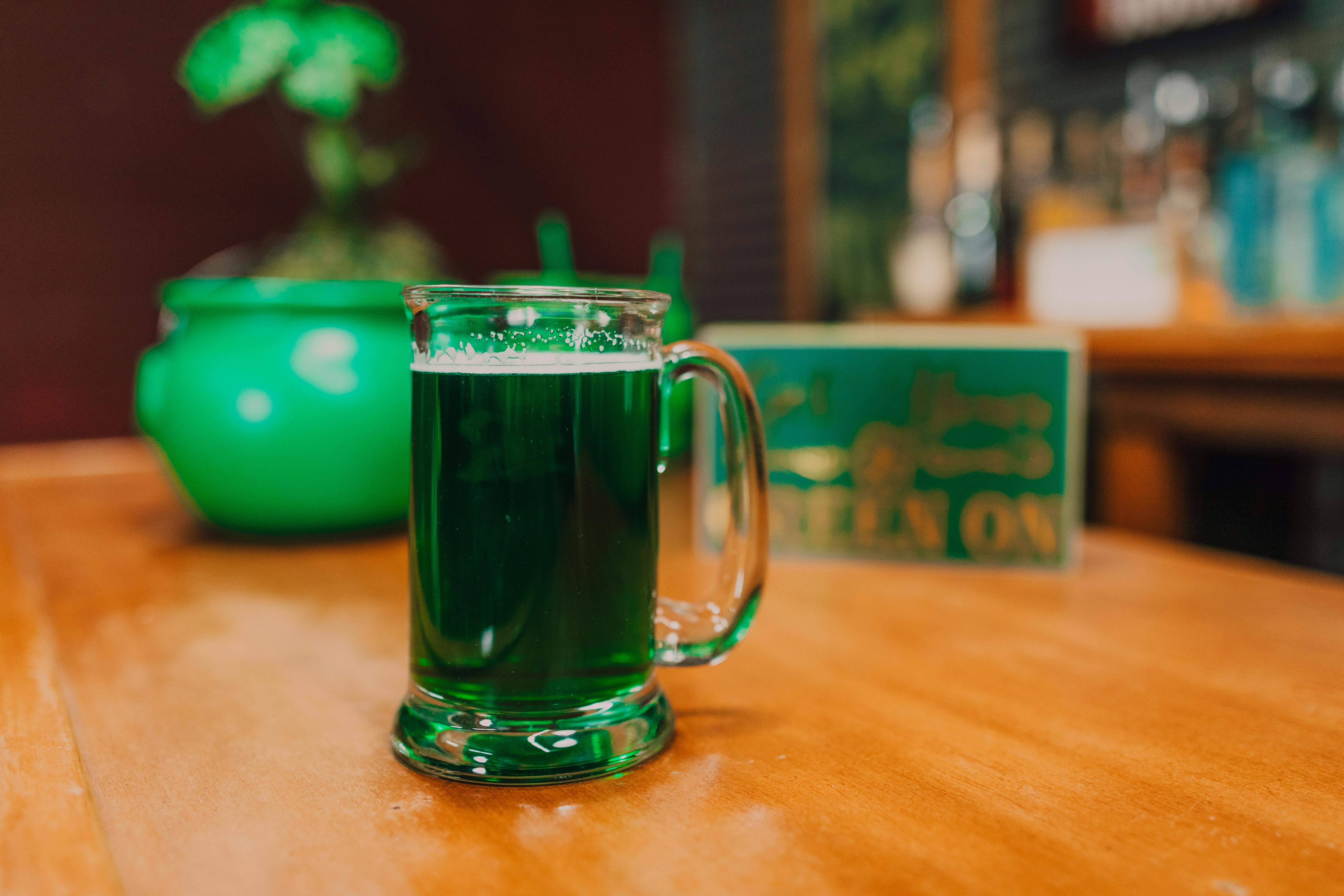 Green beer on bar table symbolizing St. Patrick’s Day celebration leading to a first-time DUI arrest and potential license consequences in Maryland
