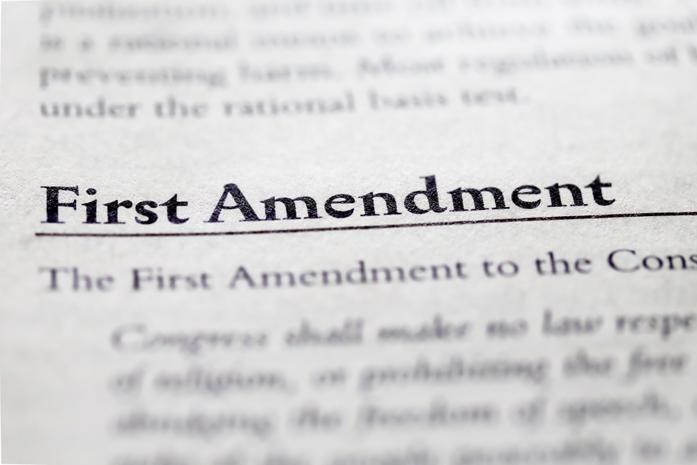 Image Close-up of the First Amendment text in a legal document, symbolizing constitutional rights and public filming laws in Maryland.