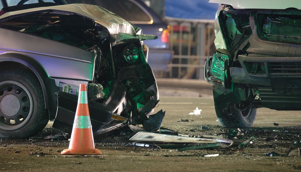 Damaged vehicles at a crash scene representing a Glen Burnie crash and the steps to take after a wreck.