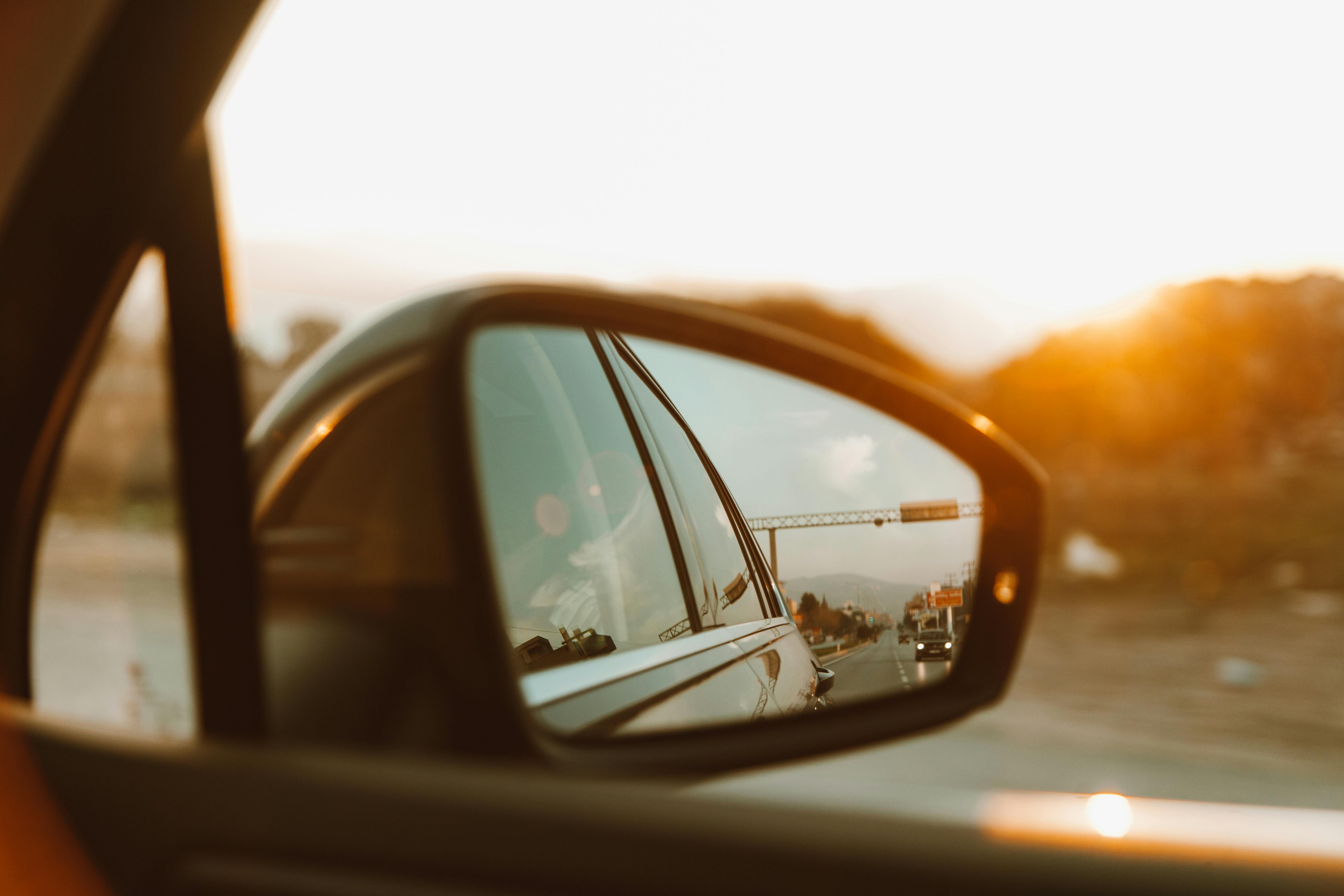 Side mirror view of holiday traffic, highlighting how Memorial Day car accidents in Ocean City can happen during crowded travel weekends.