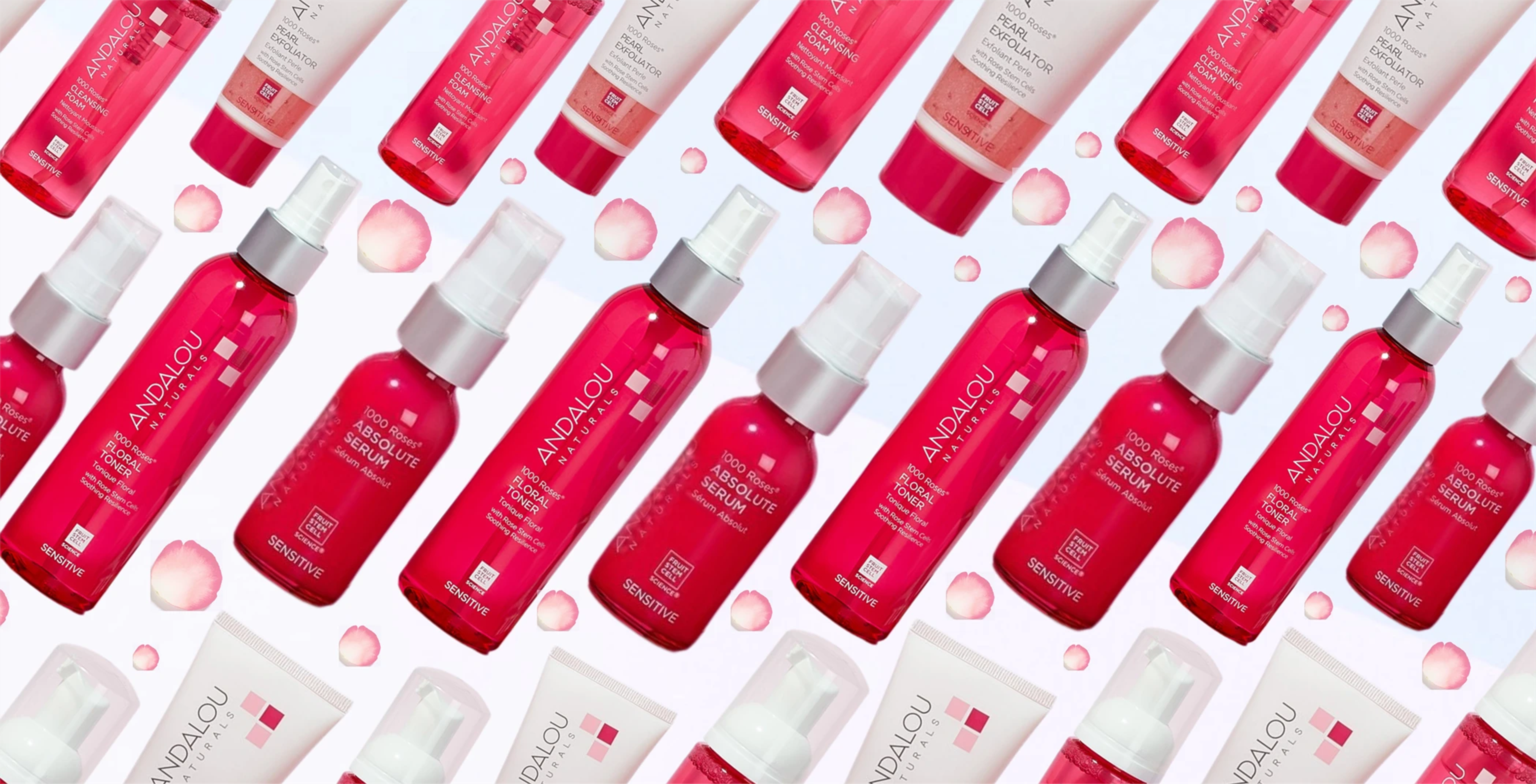 Andalou Naturals serum and floral toner alternating in a fun pattern with rose petals in between.