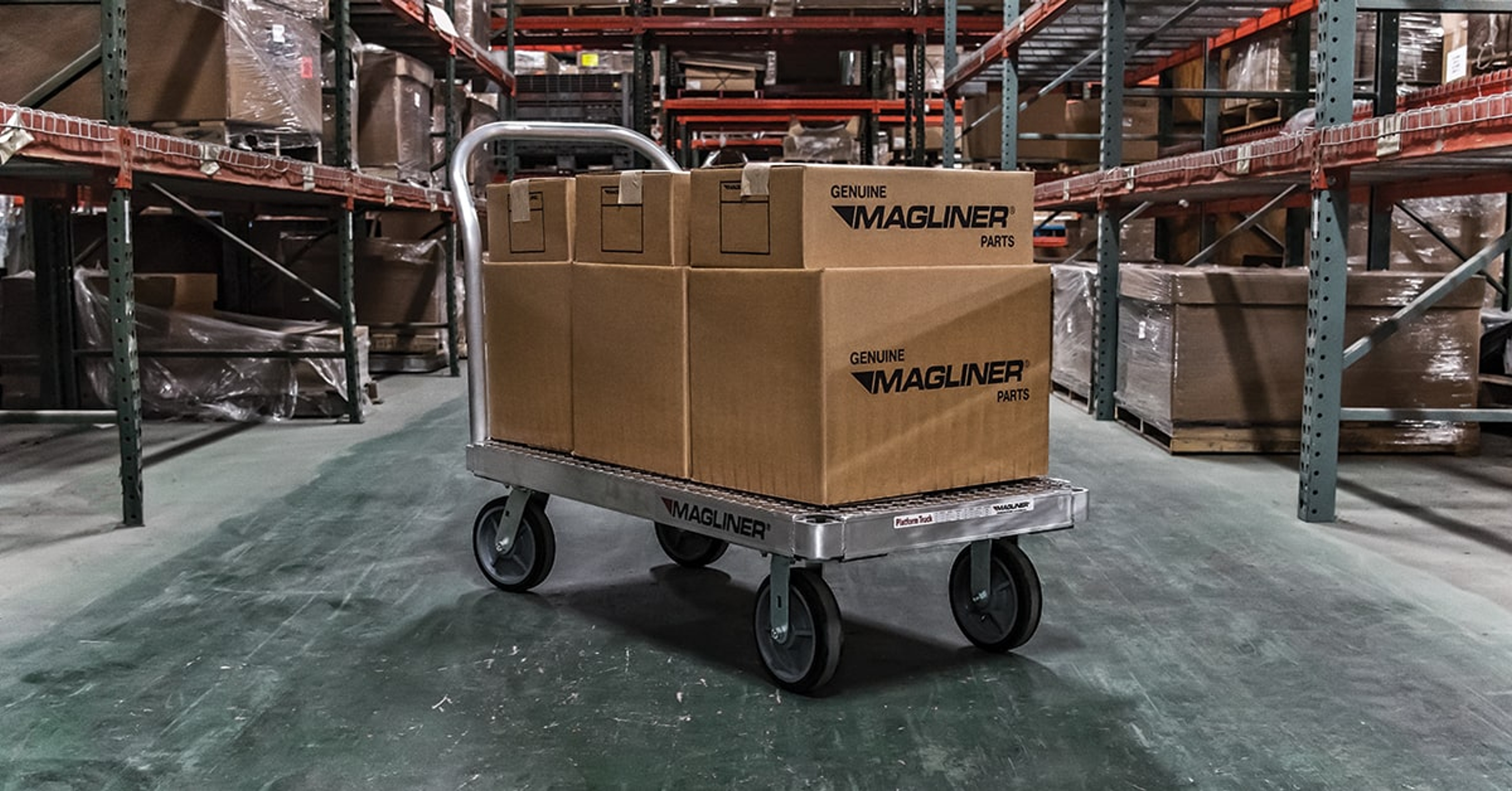 A magliner hand truck to move stacked boxes in a warehouse.