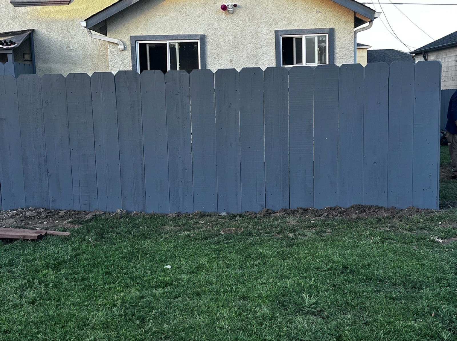 Completed wood fence installation between neighboring properties in Watsonville — after photo