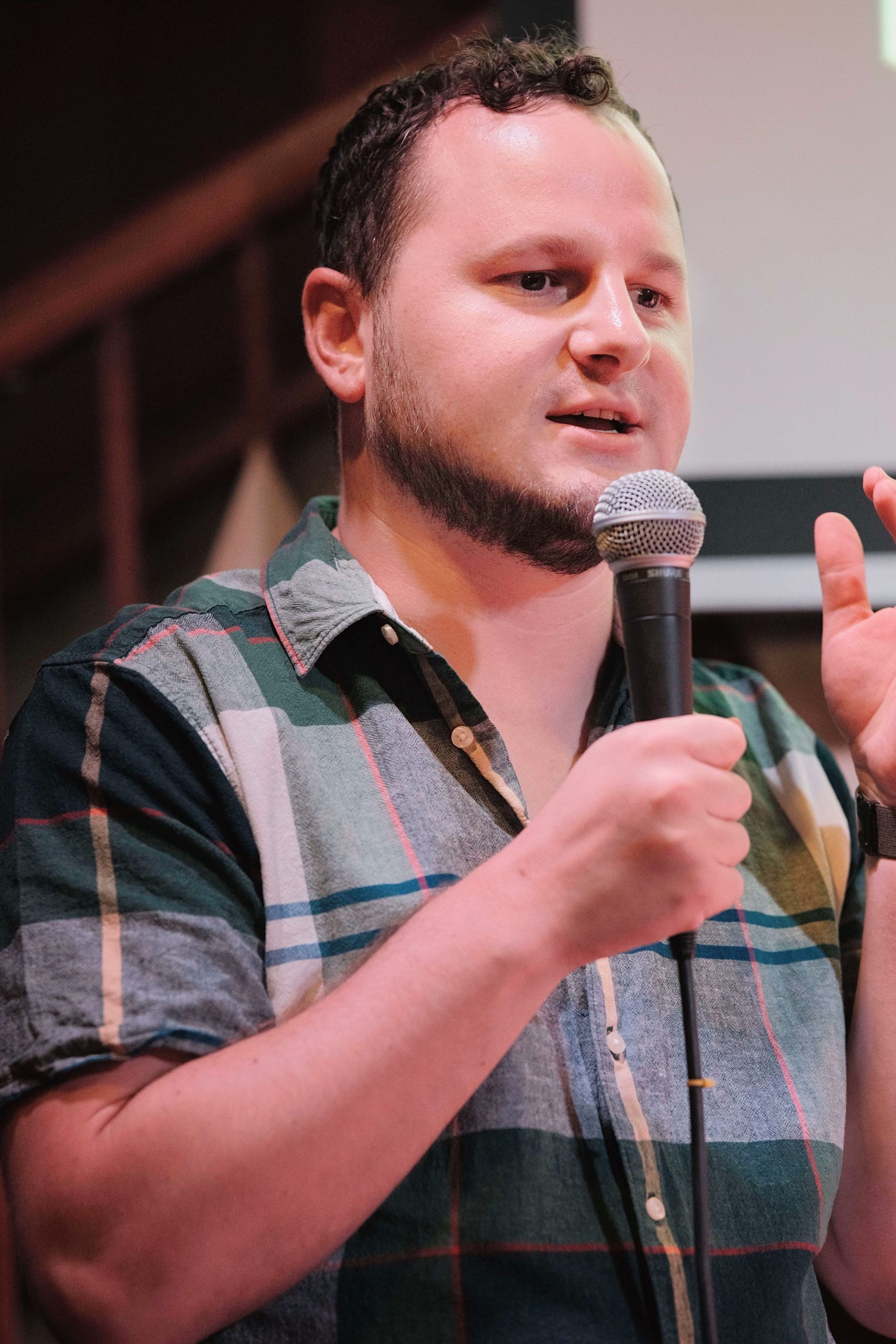 Yordan Dimitrov speaking with a microphone in his hand.