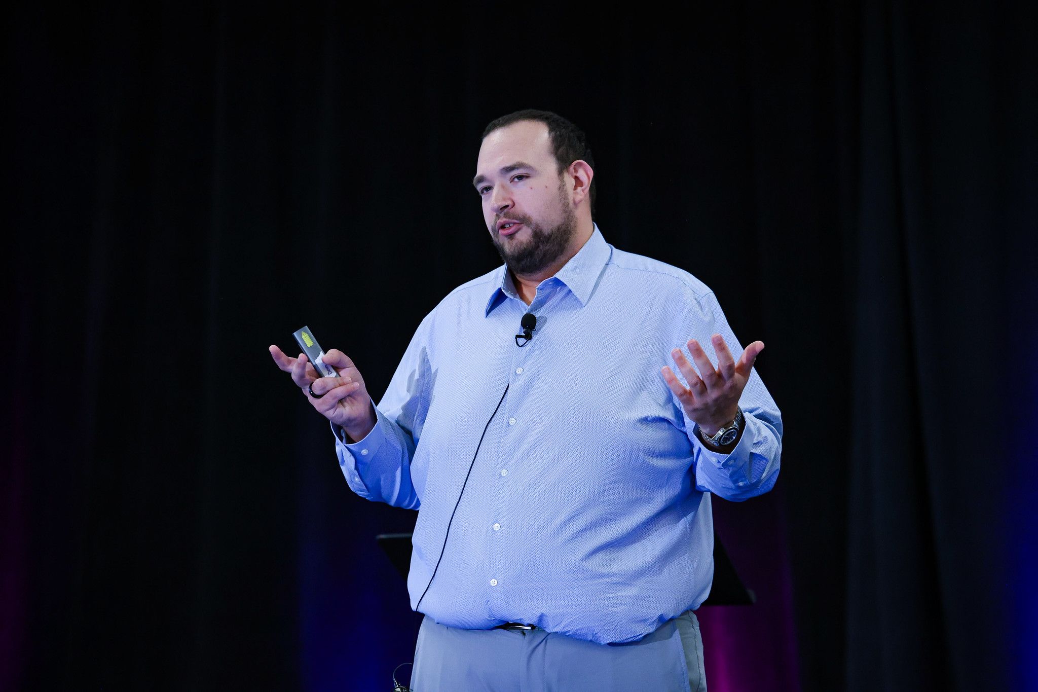 Zach speaking at a conference