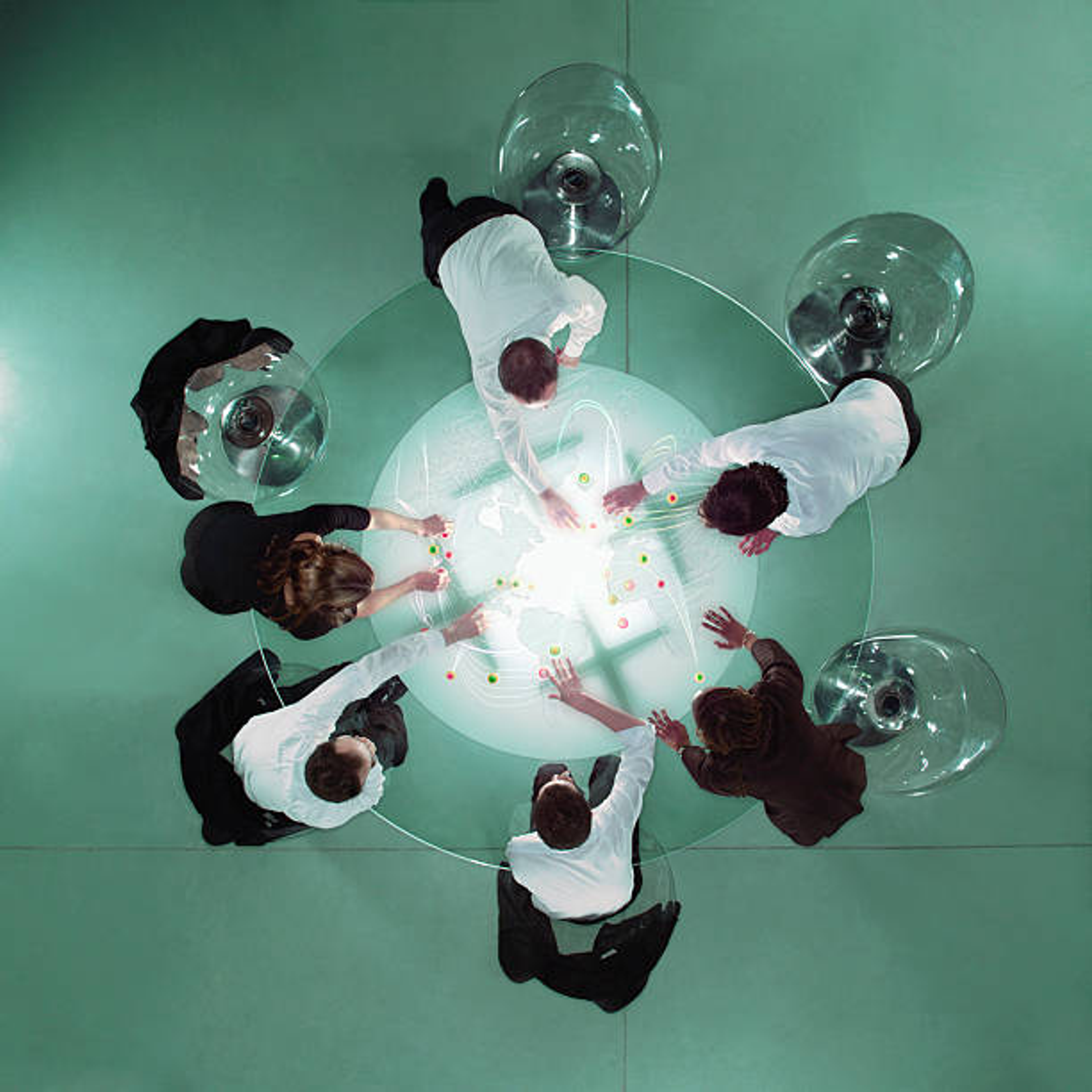 Team planning marketing strategy around a table
