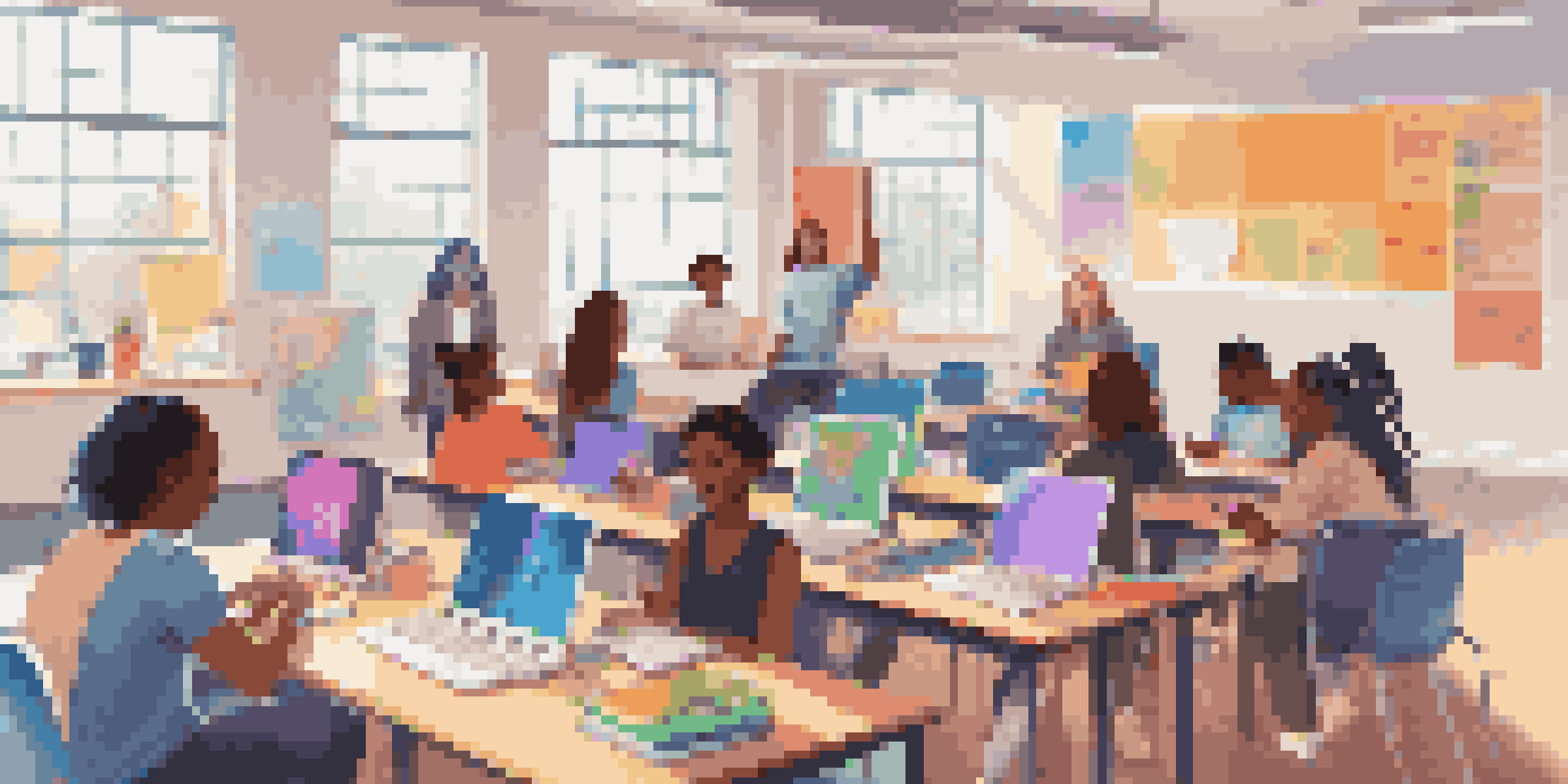 A diverse group of students participating in an online learning session in a bright classroom.