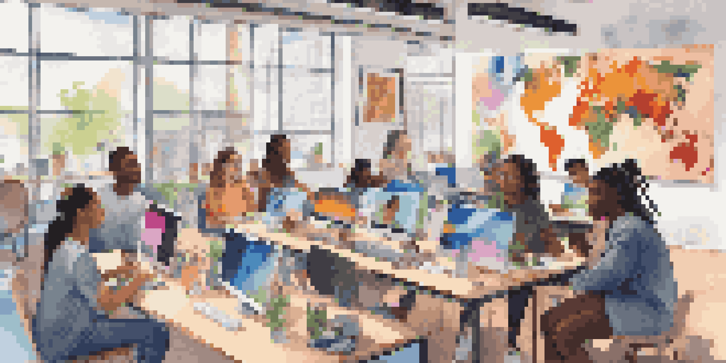 A diverse group of students collaborating online, surrounded by laptops and cultural posters, with a video call on the screen.