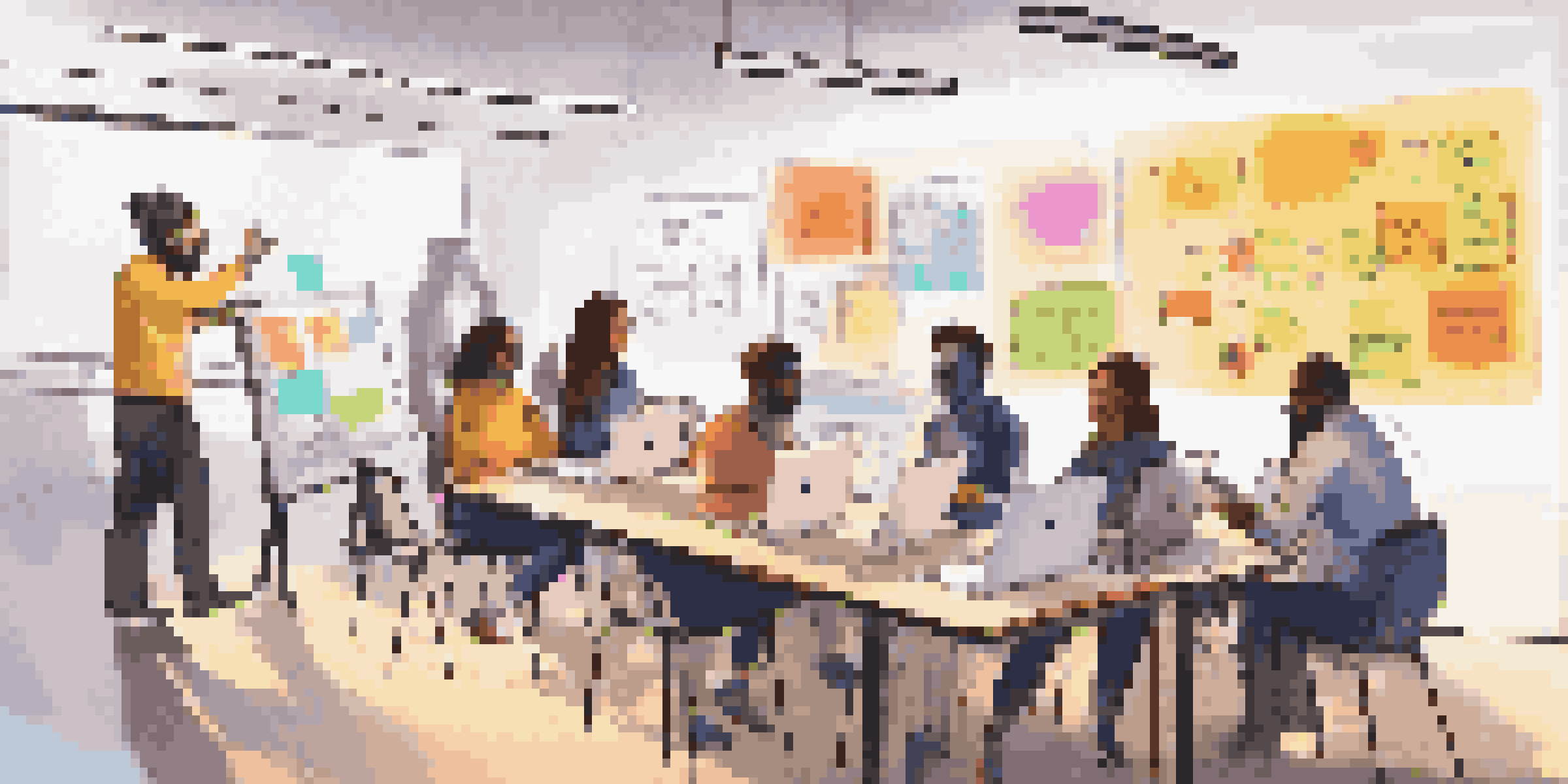 A group of diverse learners collaborating in an online learning community, surrounded by colorful sticky notes and laptops, engaged in a brainstorming session.
