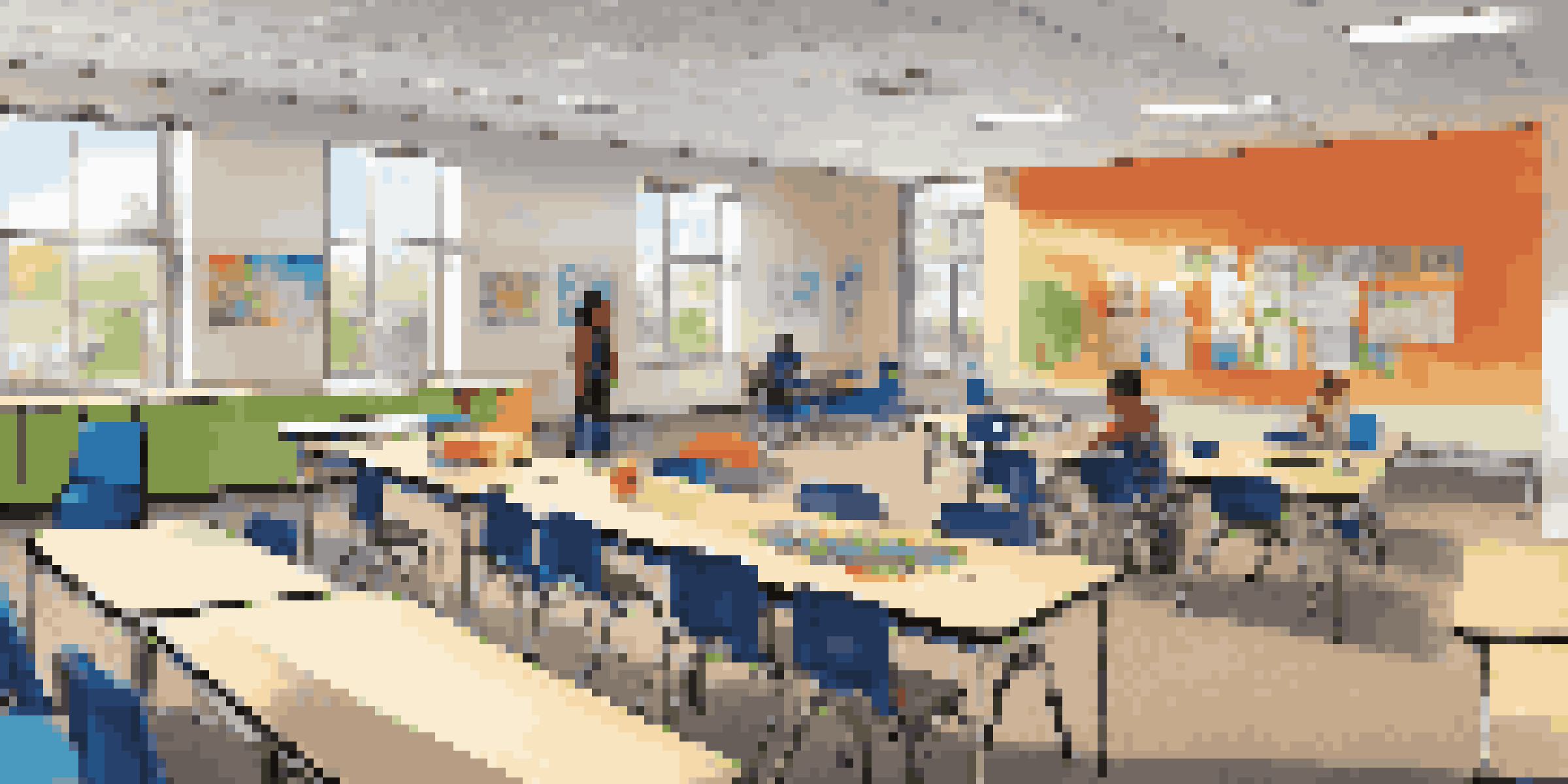 A flexible classroom with movable furniture, natural light, and diverse students engaged in various learning activities.