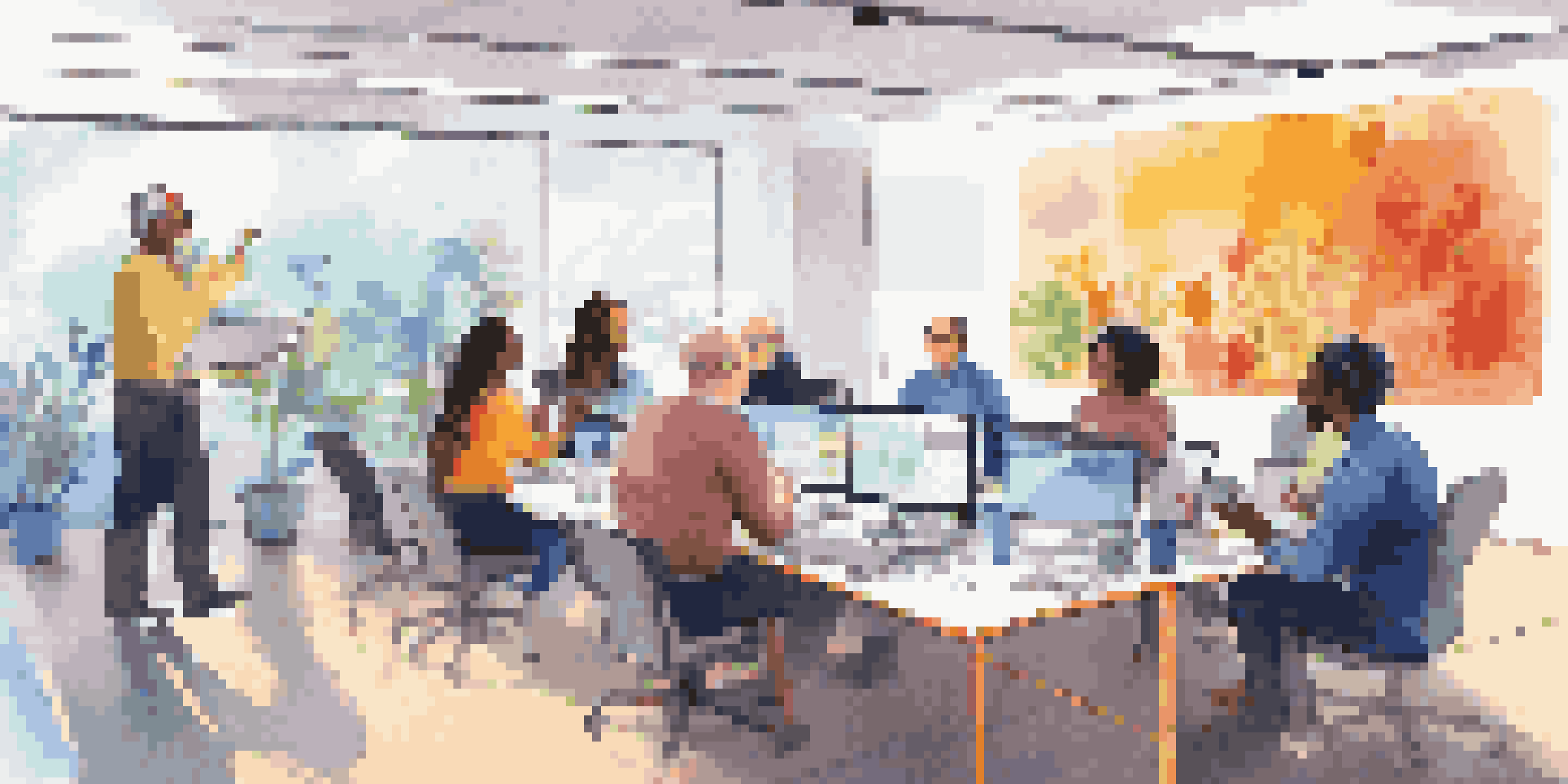 A diverse group of people participating in a lively virtual meeting with laptops and a shared screen showing ideas.