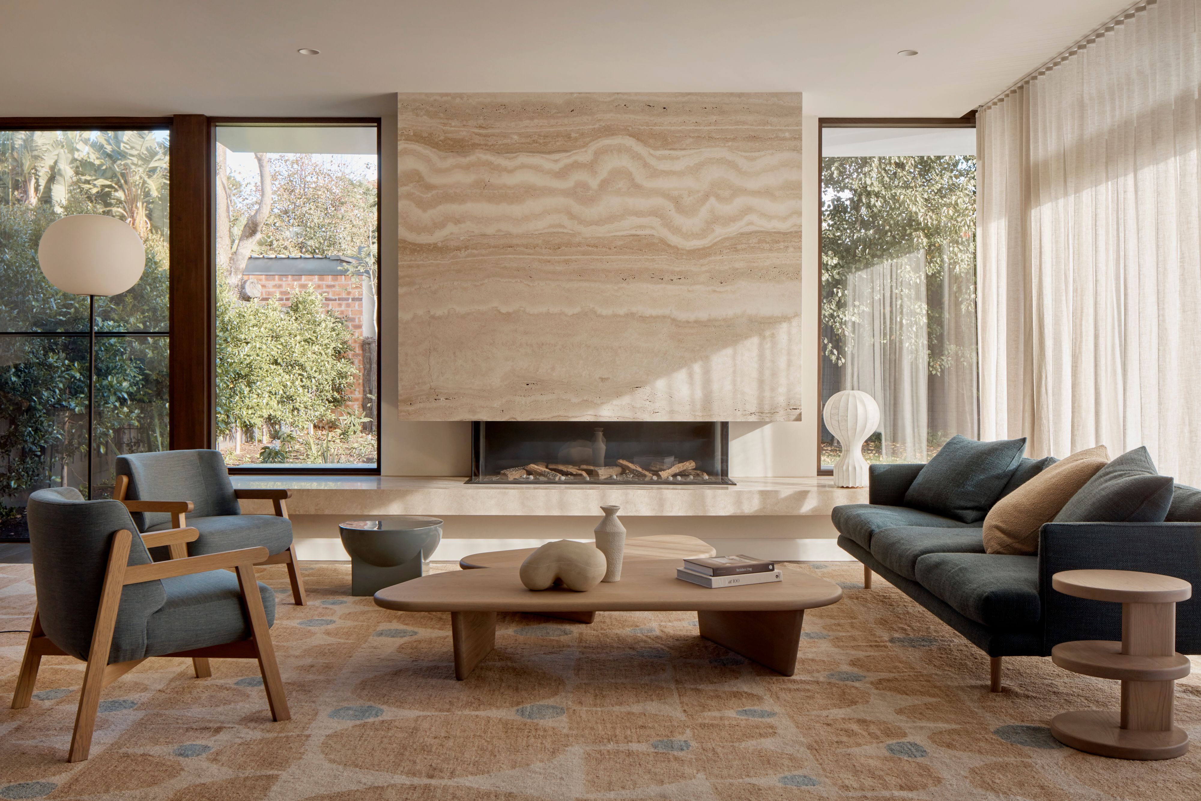 image of Kent House - Travertine fireplace in living room
