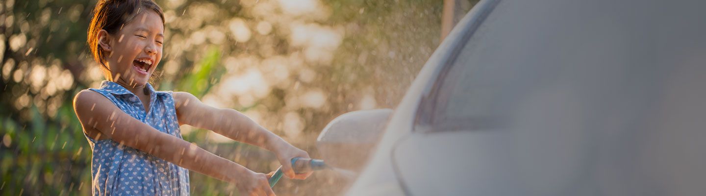 Girl washing a car