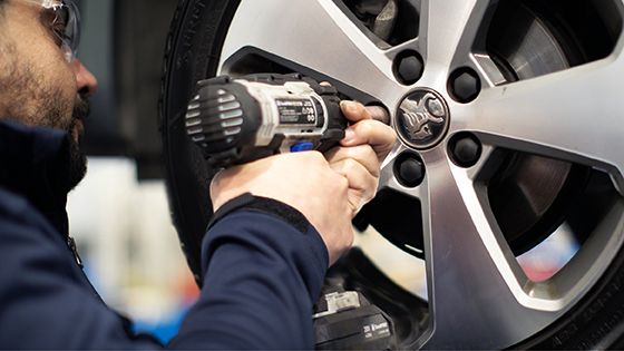 mechanic repairing wheel hub