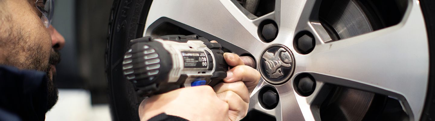 Mechanic repairing a car tyre