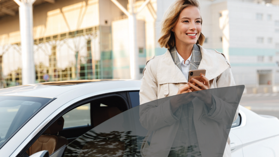 Woman getting out of car with tinted windows