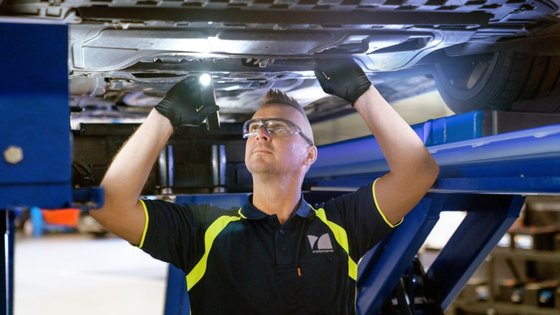 motorserve mechanic inspecting car in workshop