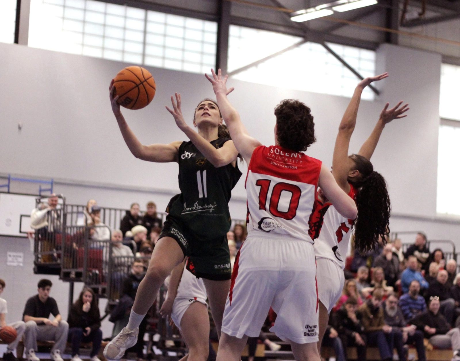 Raiders Women Sinking a Basket