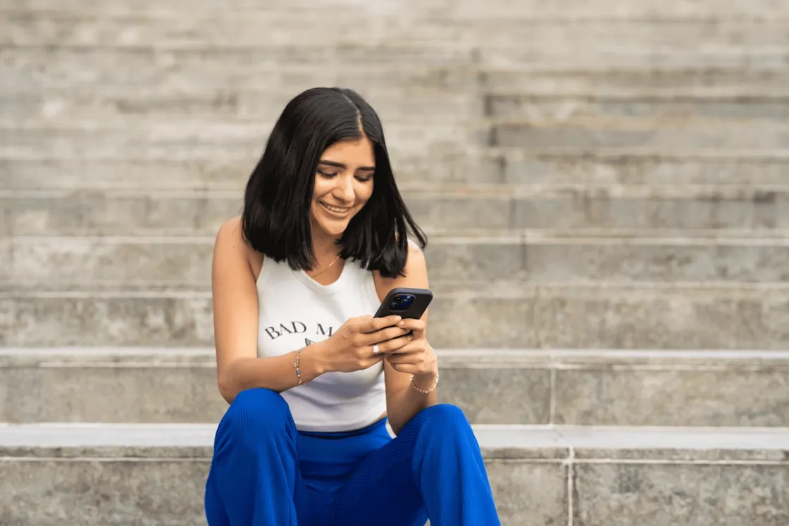 Woman checking phone for appointments