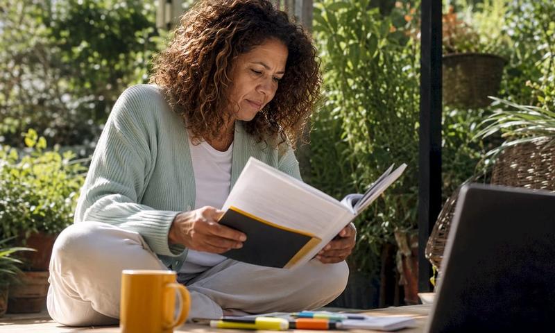 Person reviewing mental health insurance benefits documents