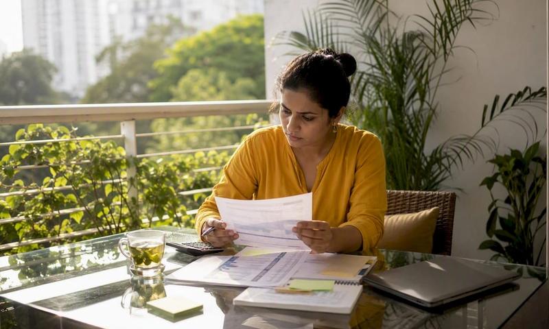 Young professional reviewing health insurance documents