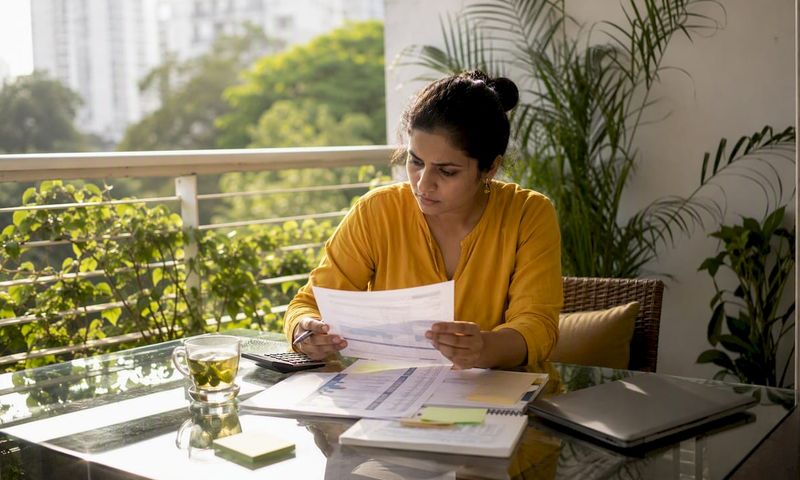 Young professional reviewing health insurance documents