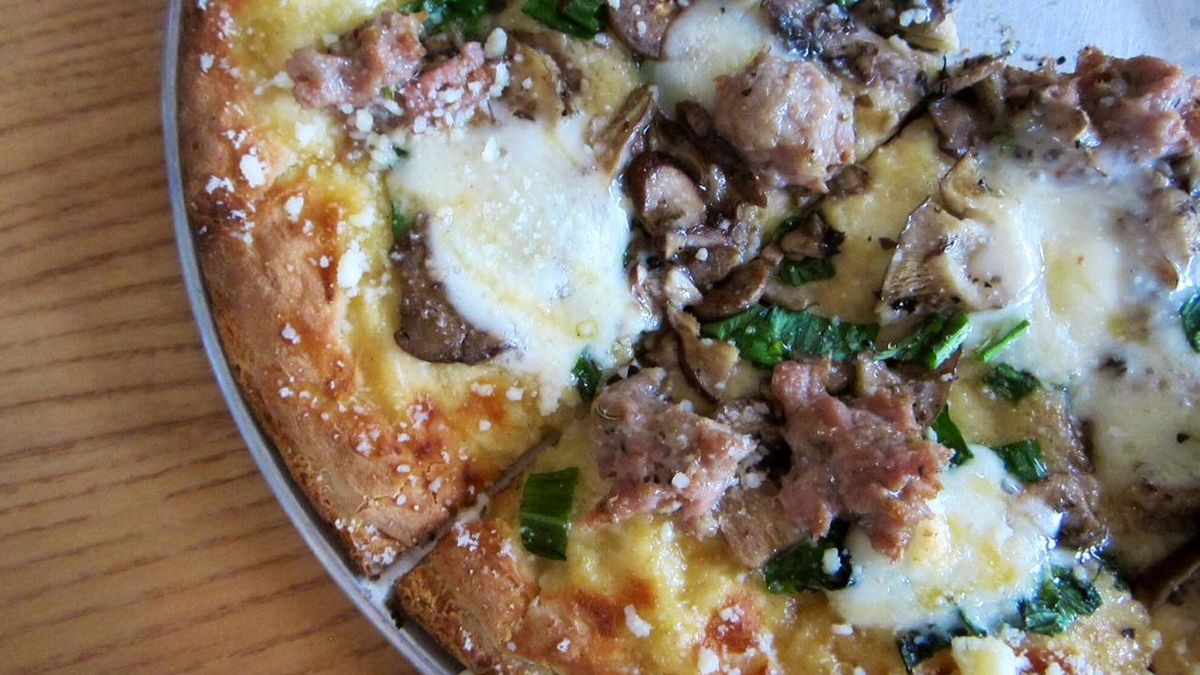 Harvest Pizza with ramps! Delicious! The special featured wild ramps from Ohio and West Virginia, truffled mushrooms from Athens County, fennel sausage, Taleggio cheese and local honey.