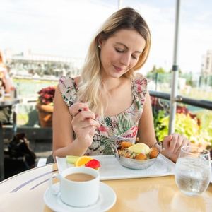 Young woman sitting tourist sit for the breakfest with coffee
