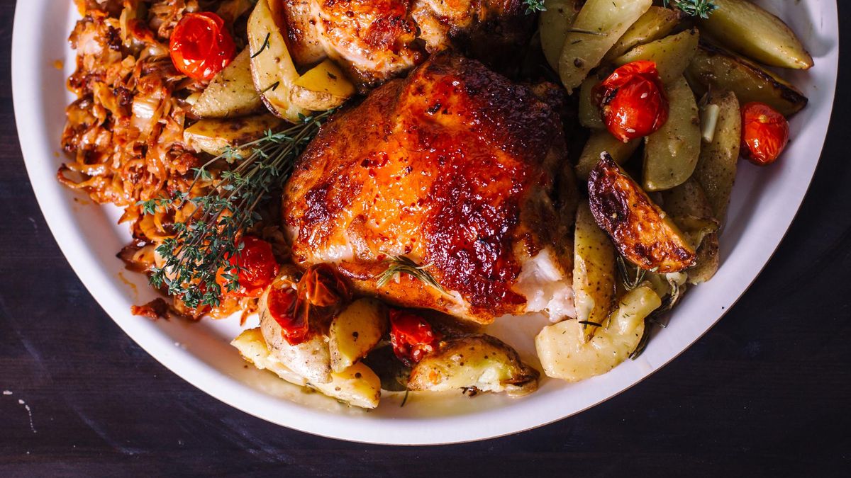 Chicken thigh with rosemary and potatoes. View from above.