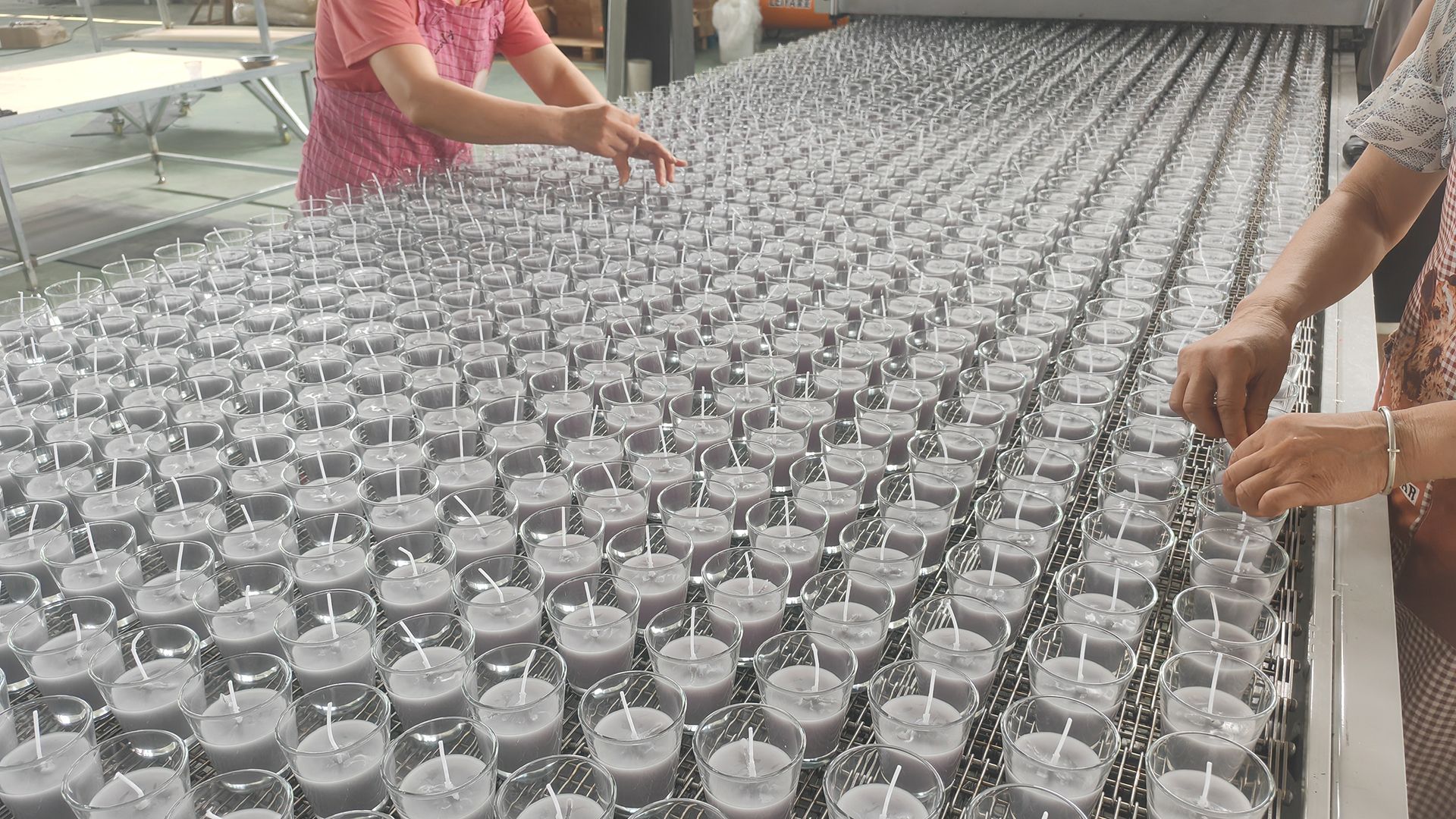 Scented candles coming off the line at the MW Candle factory