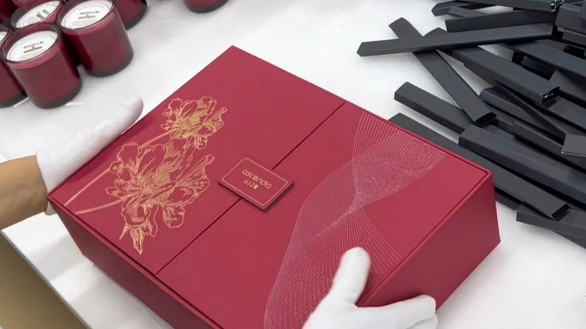 Gift boxes being assembled and ribboned