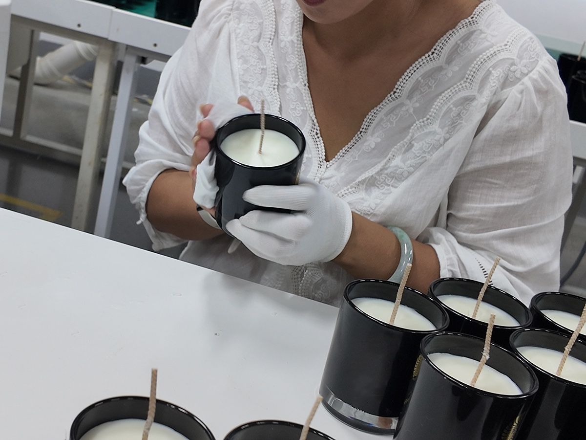 Quality inspection bench checking finished candles