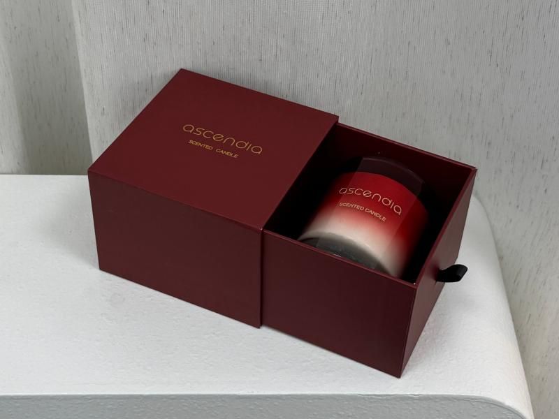 Single candle in a gift box