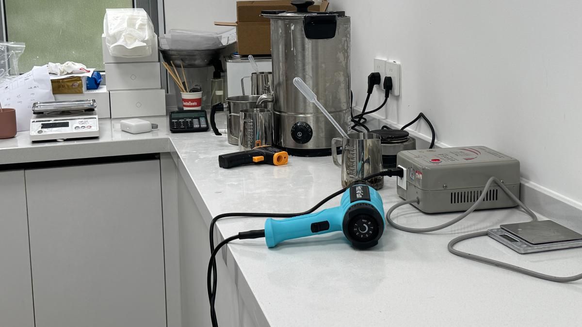 Sample candles laid out on the bench for approval before a production run