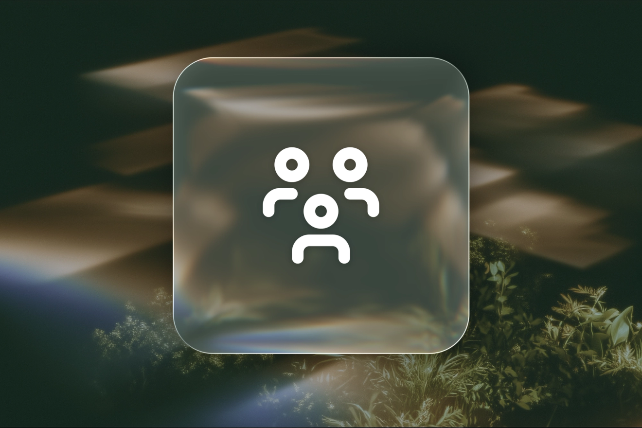 A white group-of-people icon on a frosted-glass tile against amber-lit fluted glass.