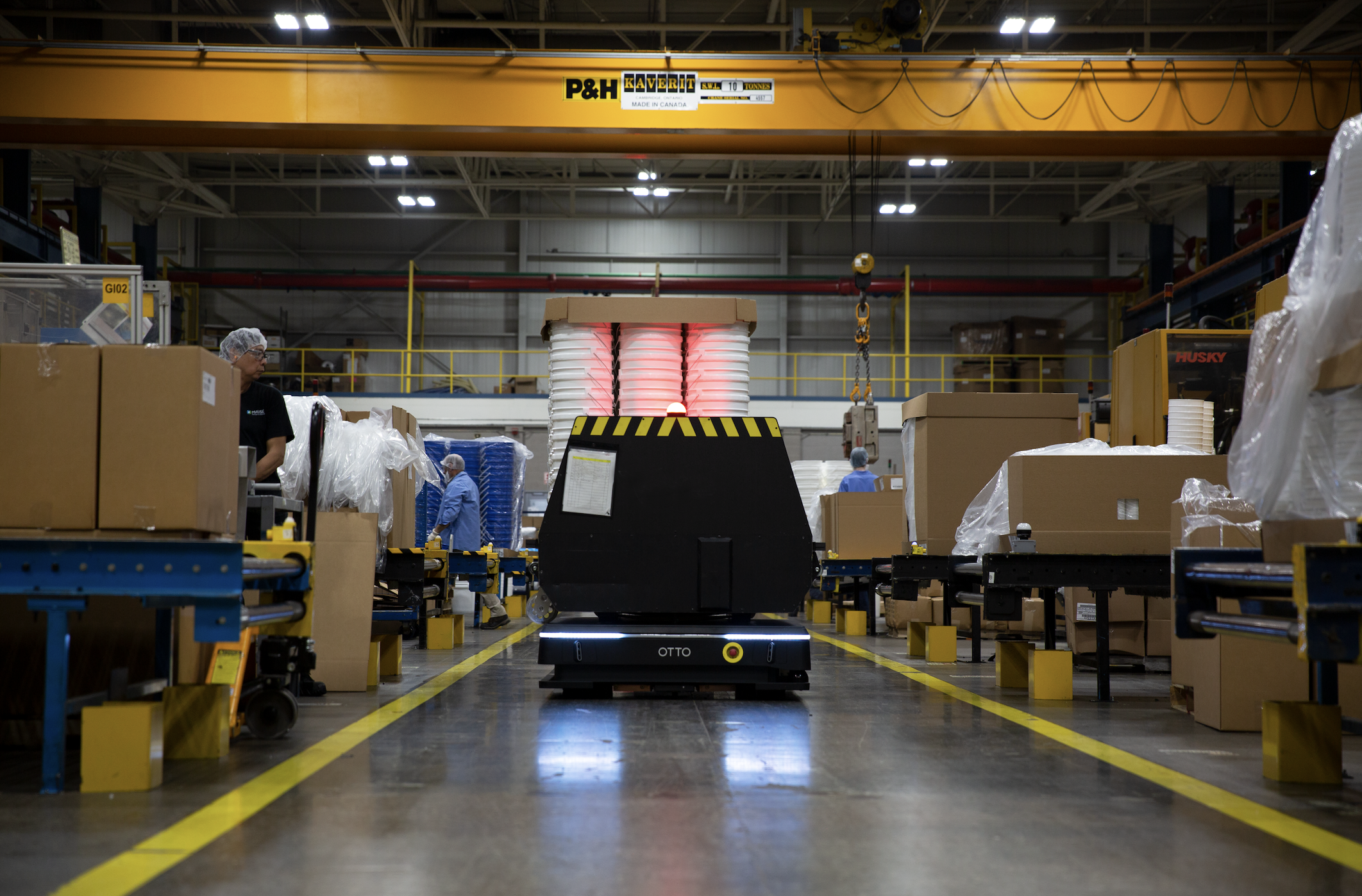 Image 1: OTTO AMRs increase productivity by allowing highly skilled laborers to transport materials from their workstations, without doing the dull and dangerous work of lifting and moving materials throughout the facility. 