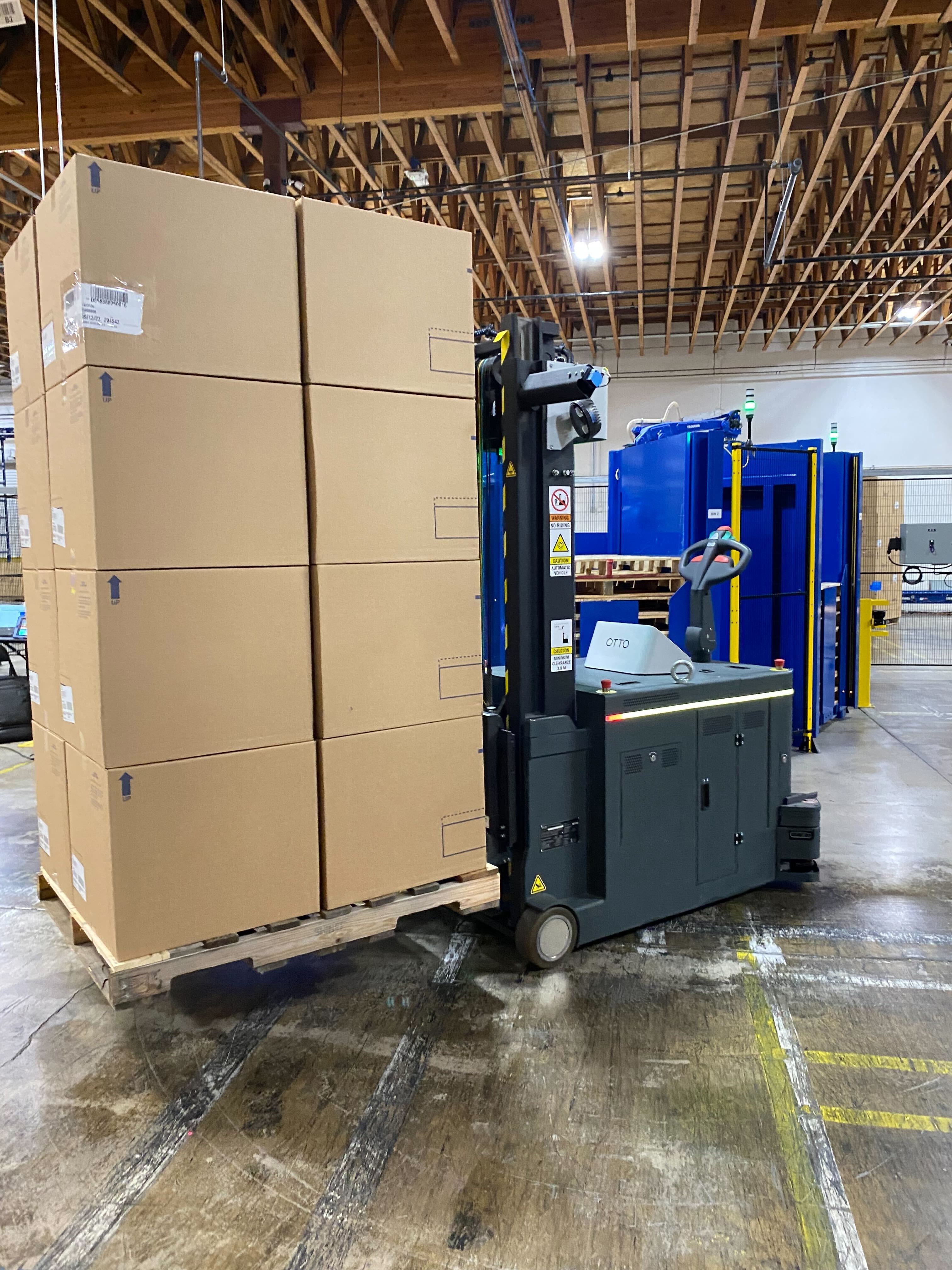 Image 2: OTTO Lifter carrying products through the Henderson, Nevada facility.