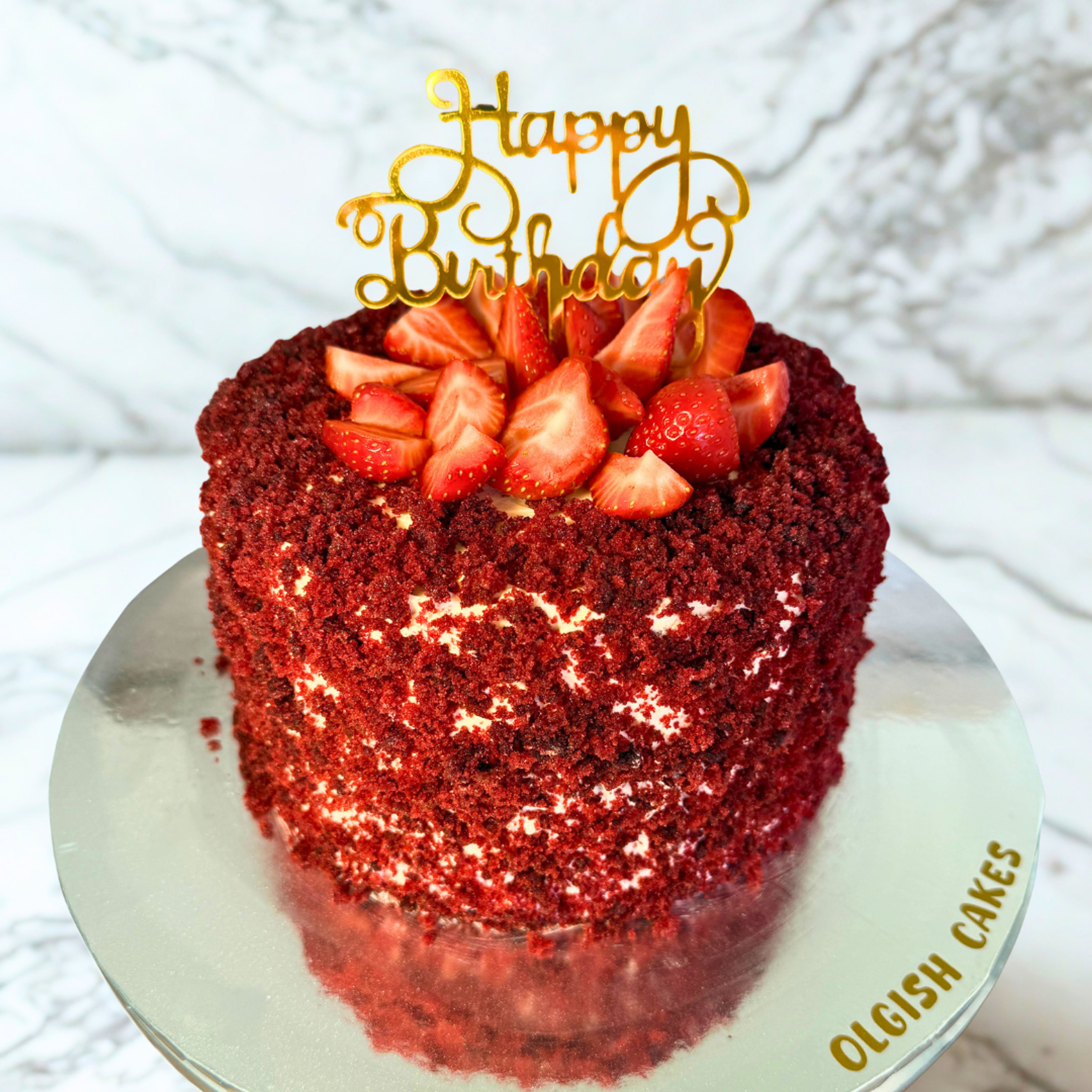 Red Velvet Cake with fruits and a happy birthday topper