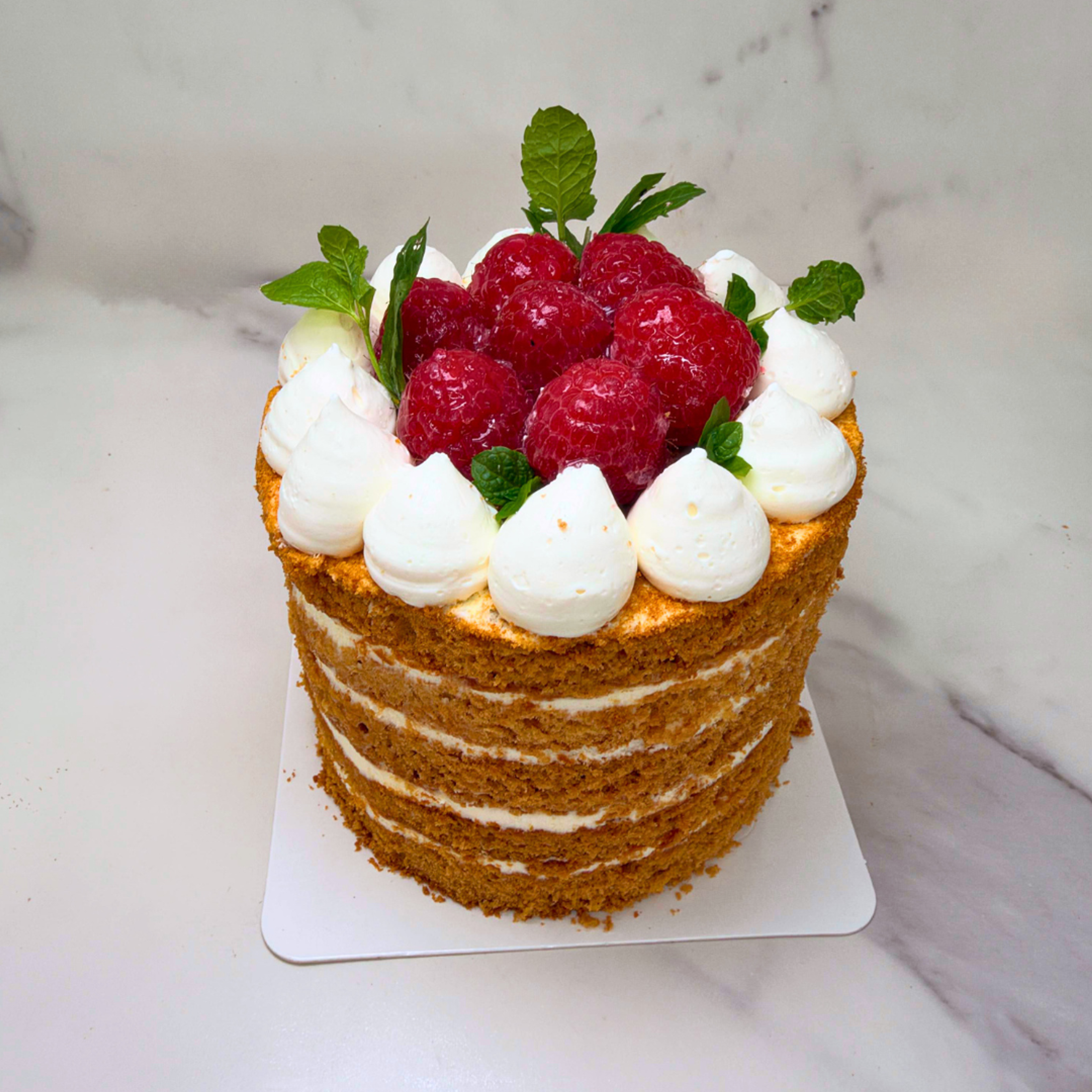 Close-up of a mini honey cake showing its decorative finish.
