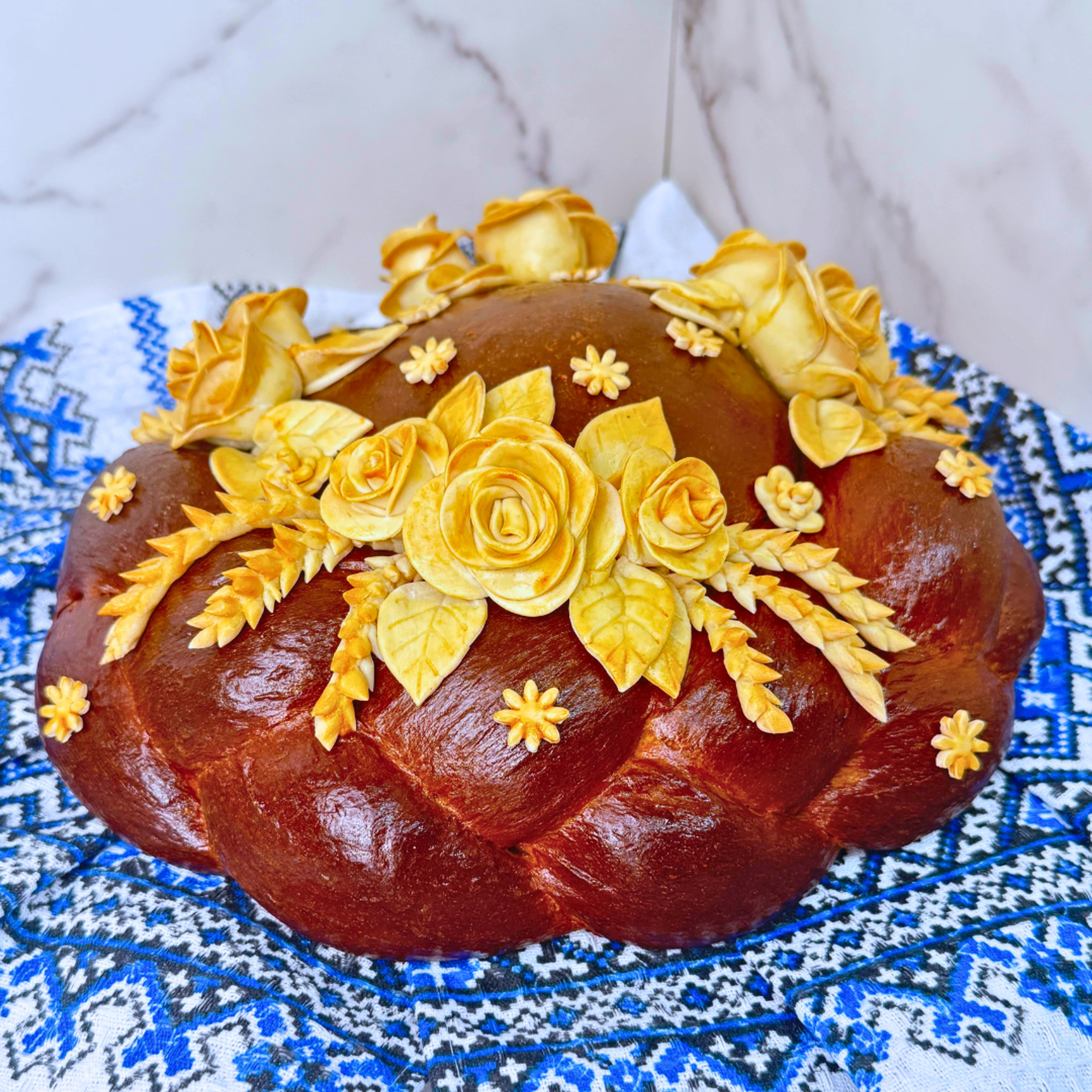 Handmade Korovai Wedding Cake with traditional Ukrainian dough decorations