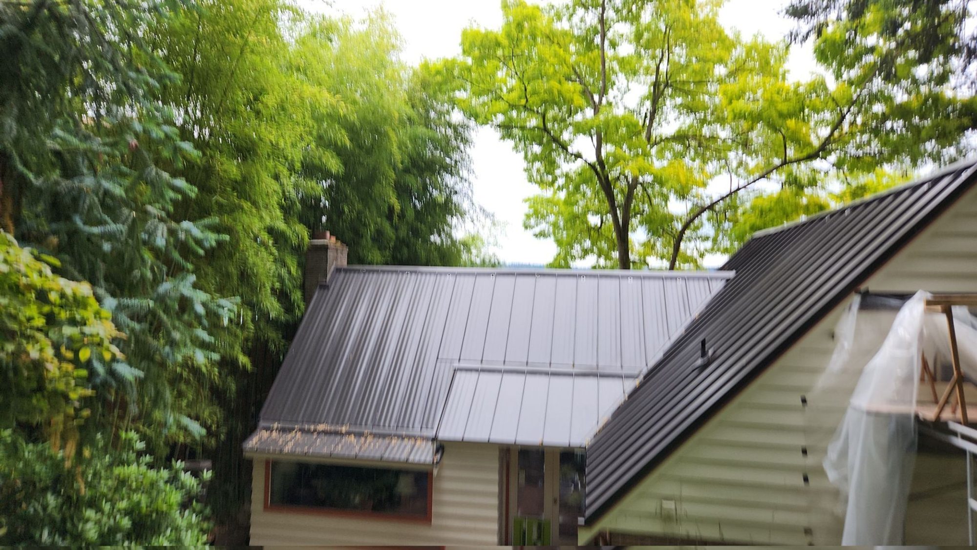 Finished Dark Bronze standing seam metal roof over the front gable and dormer, Bellevue, WA