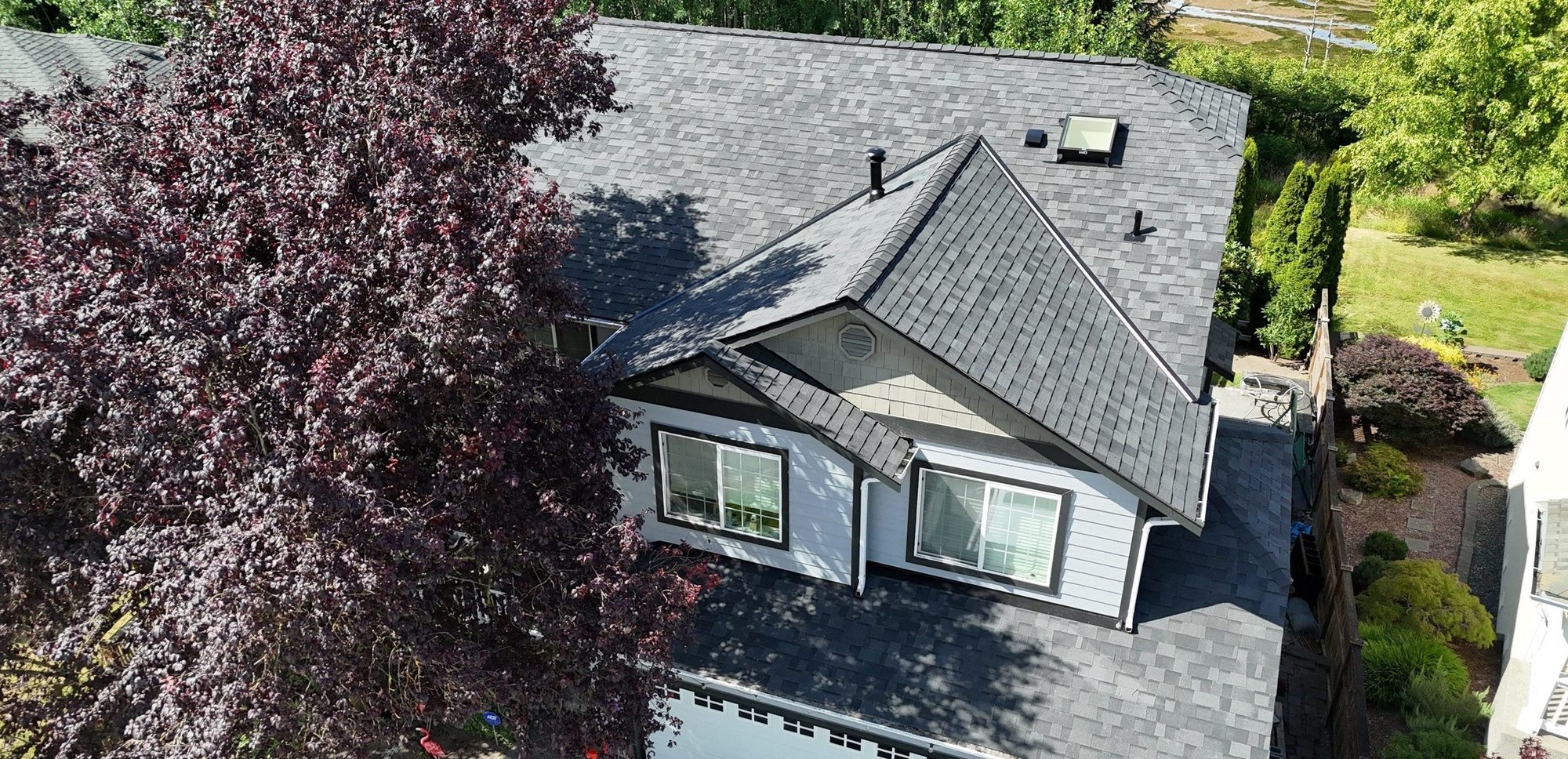 Drone view of the finished Malarkey Midnight Black asphalt shingle roof, Marysville, WA, by Amor Roofing