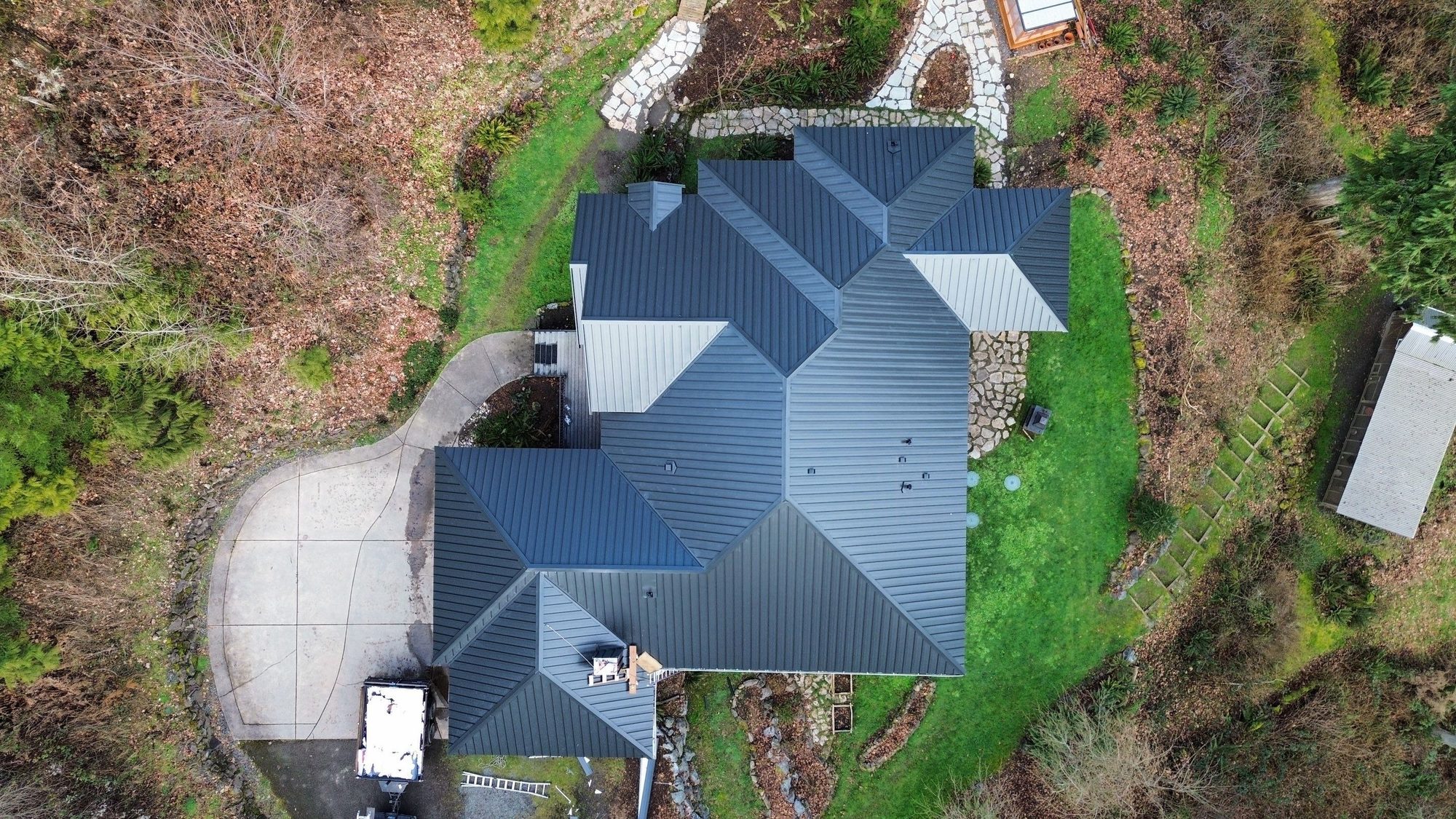 Amor Roofing Matte Black metal roof in Snohomish, overhead drone roof geometry