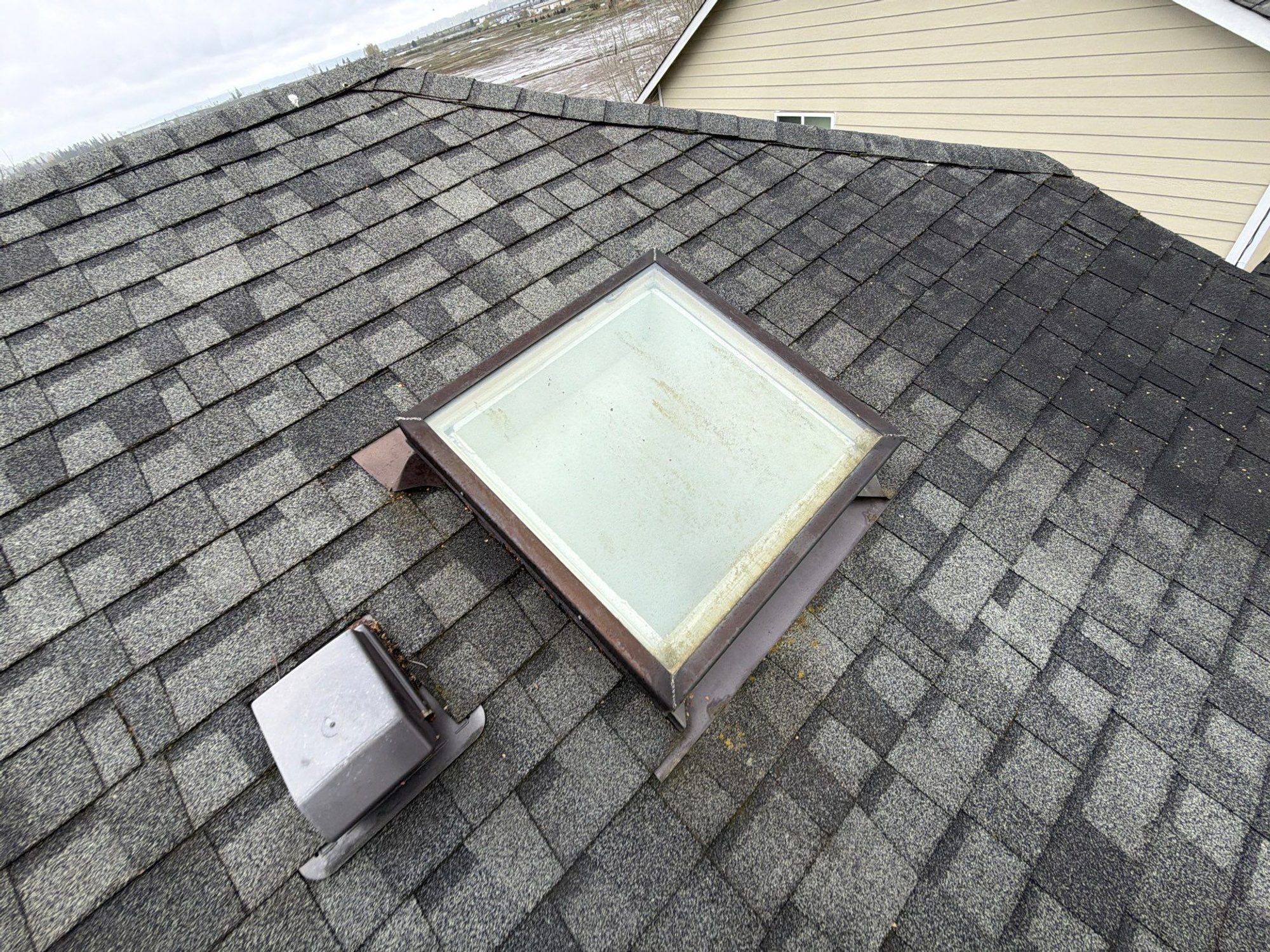 Amor Roofing Midnight Black asphalt roof in Marysville, skylight detail