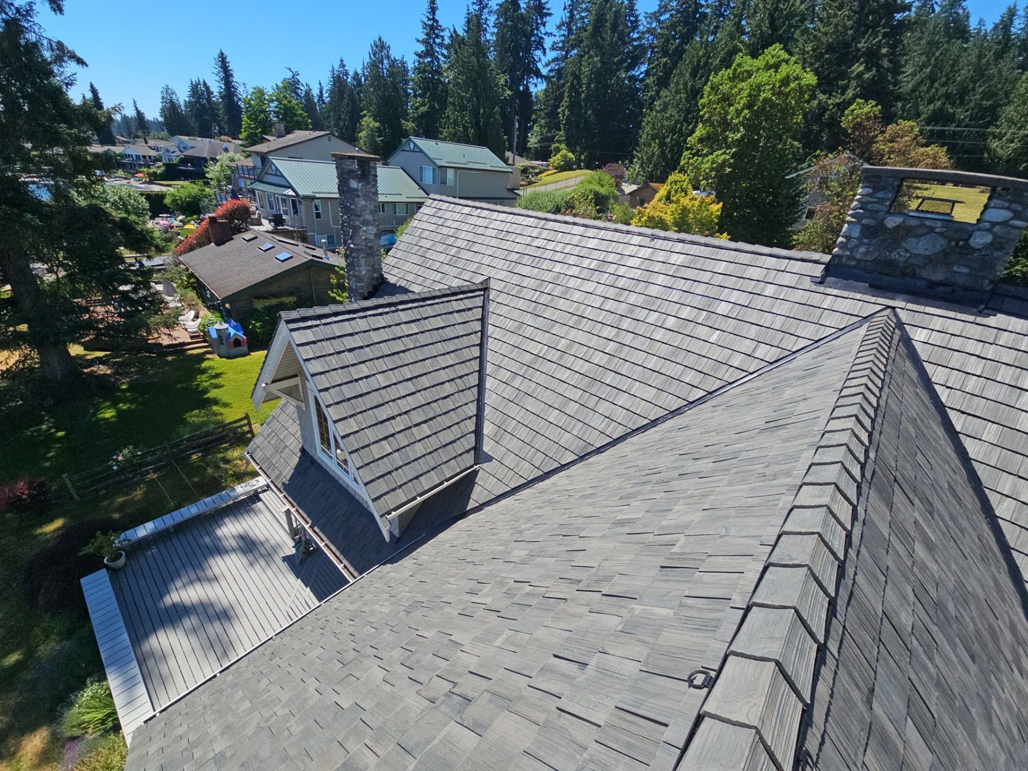 Amor Roofing Canyon Gray composite roof in Stanwood, aerial dormer neighborhood