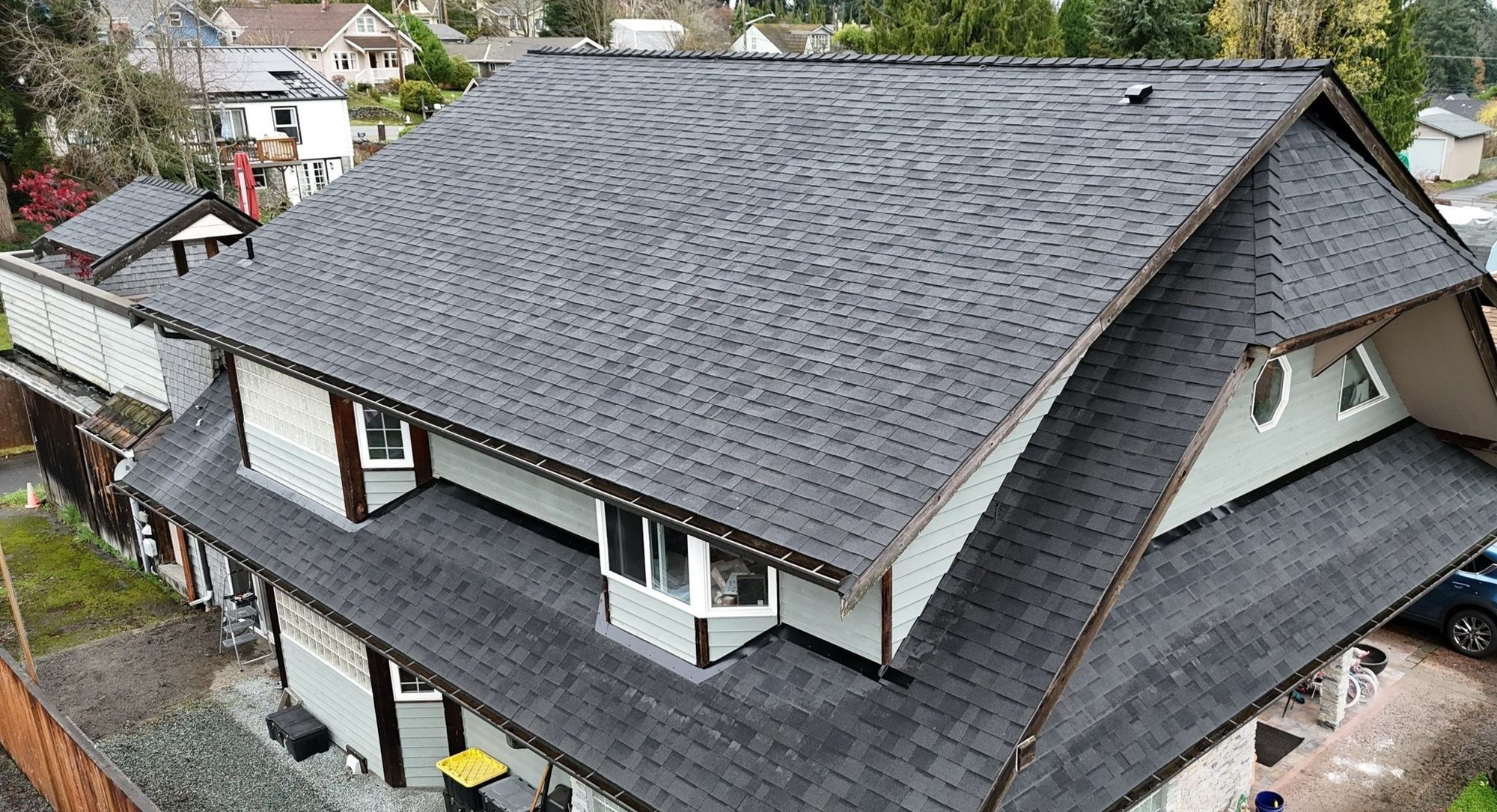 Drone view of the finished Malarkey Midnight Black asphalt shingle roof, Everett, WA, by Amor Roofing