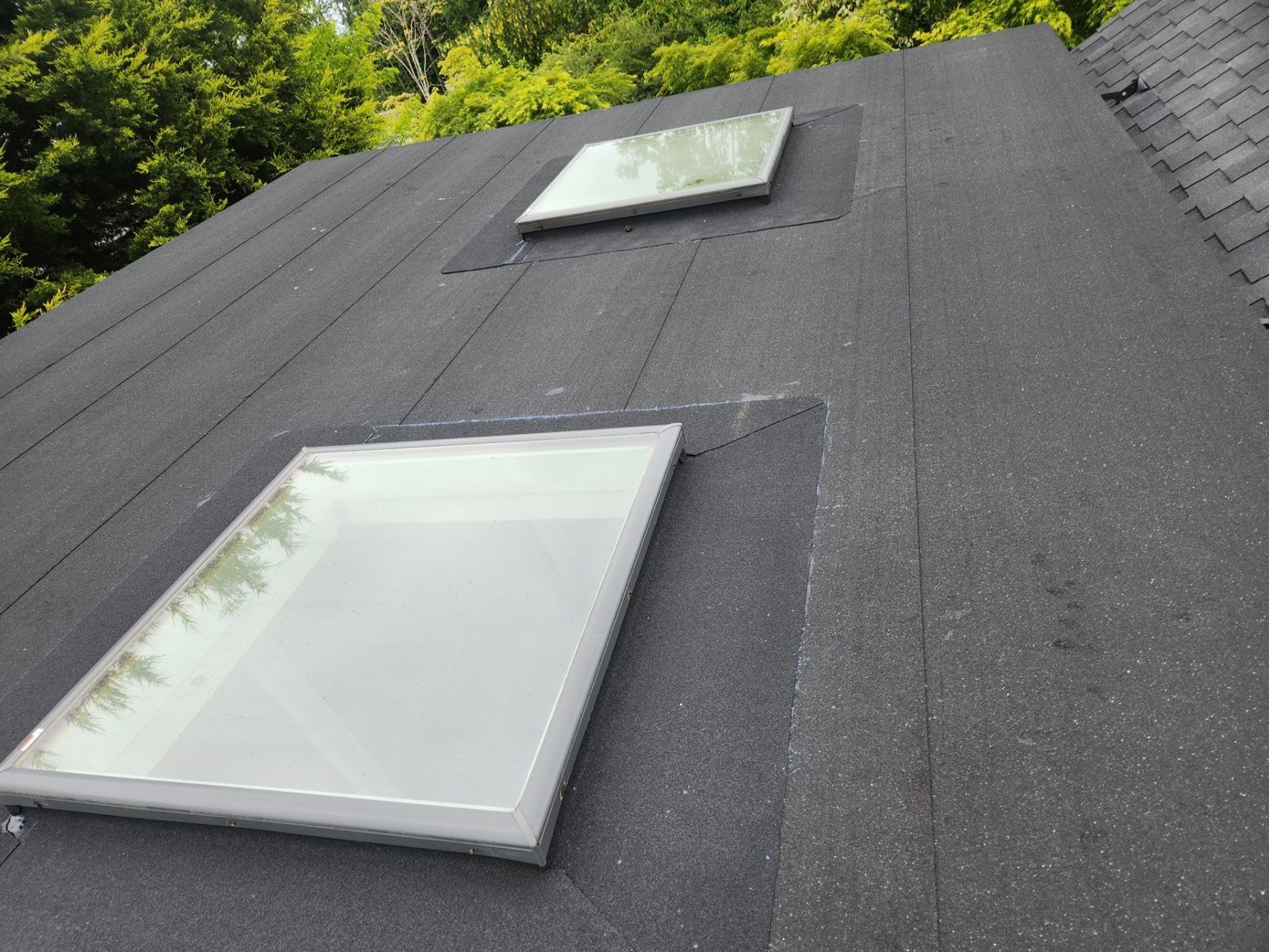 Pair of new skylights flashed into the Midnight Black designer shake roof, Brier, WA
